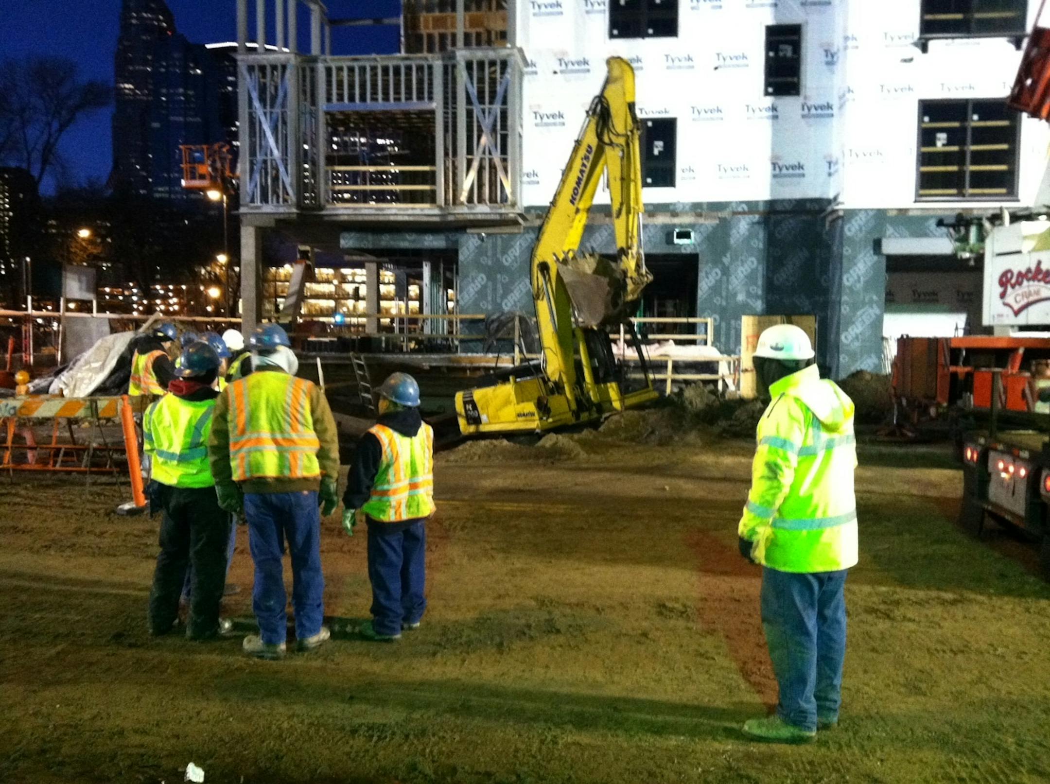 Workers were preparing Friday morning to remove the equipment that apparently broke open the water main that flooded part of downtown Minneapolis.