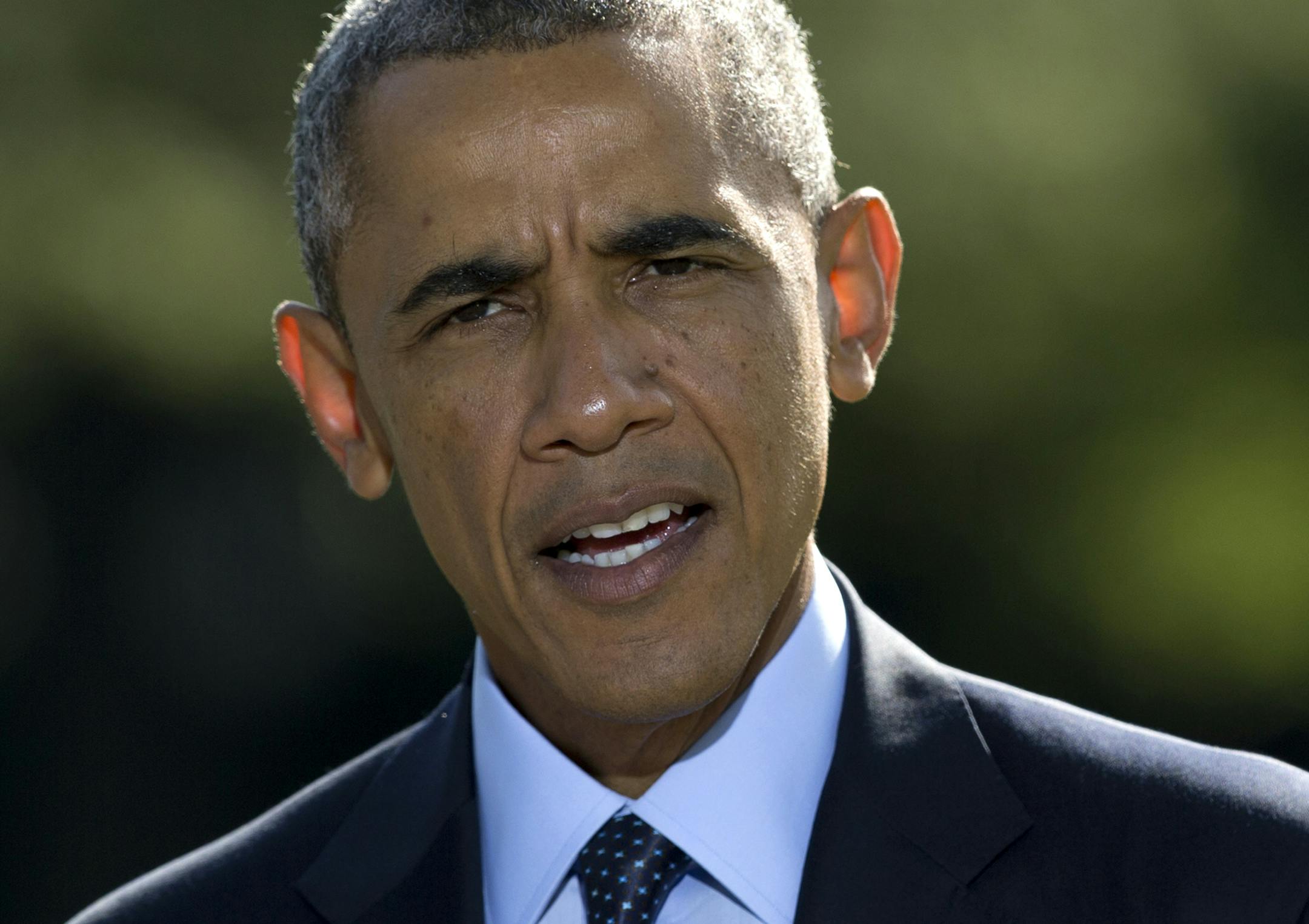 President Barack Obama speaks about the participation of five Arab nations in airstrikes against militants in Syria., Tuesday, Sept. 23, 2014, on the South Lawn the White House, in Washington, before heading to the United Nations. The president said the participation of five Arab nations in airstrikes against militants in Syria "makes it clear to the world this is not America's fight alone." (AP Photo/Carolyn Kaster)
