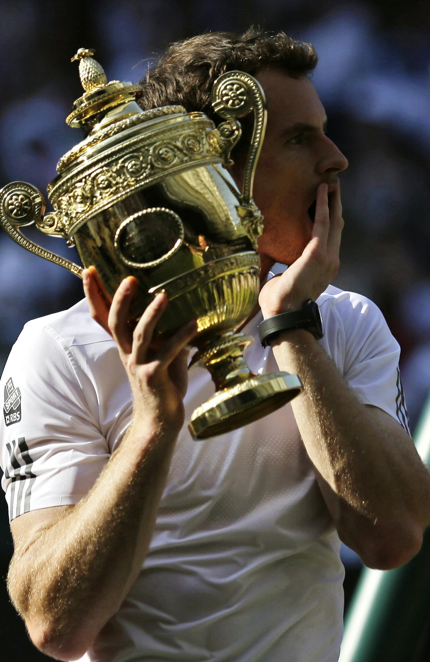 Andy Murray of Britain poses with the trophy after he defeated Novak Djokovic of Serbia in the Men's singles final match at the All England Lawn Tennis Championships in Wimbledon, London, Sunday, July 7, 2013. (AP Photo/Anja Niedringhaus, Pool) ORG XMIT: WIM357