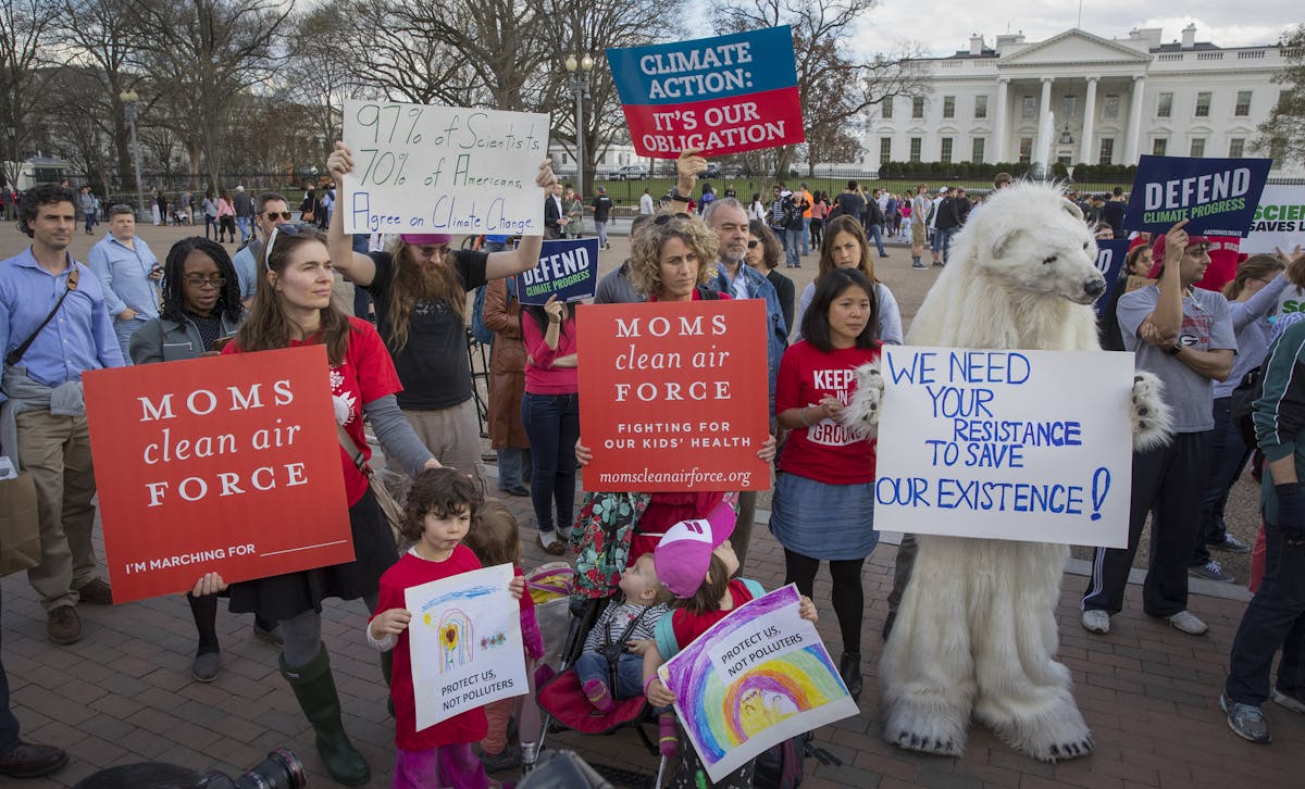 FILE-- Protesters, one in a polar bear costume, demonstrate against President Donald Trump's executive order outside the White House in Washington, Ma