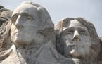 The busts of Presidents George Washington and Thomas Jefferson at Mount Rushmore National Memorial in South Dakota.