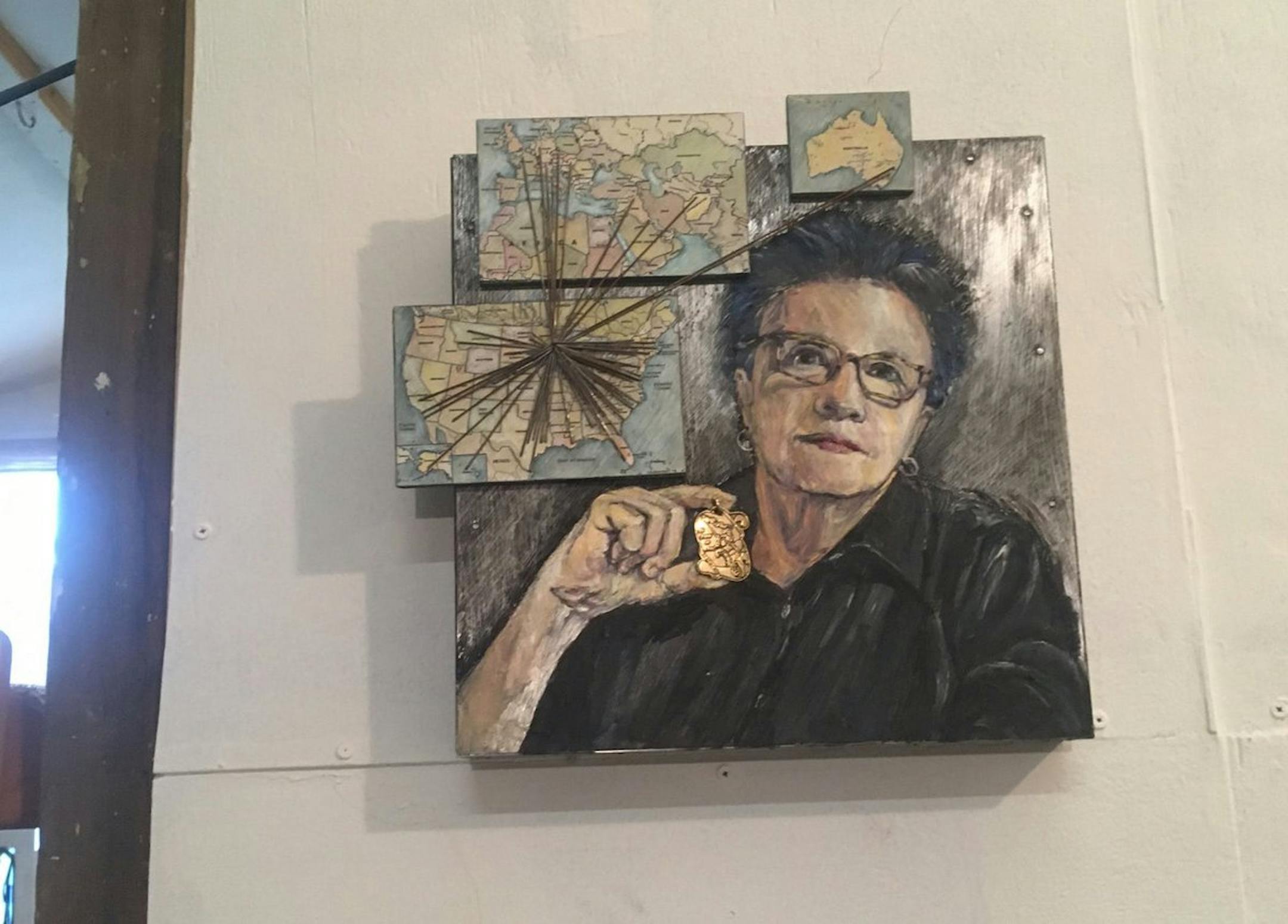 In this self-portrait, Pat Benincasa held her Joan of Arc medal under a map showing its global reach to offer comfort.