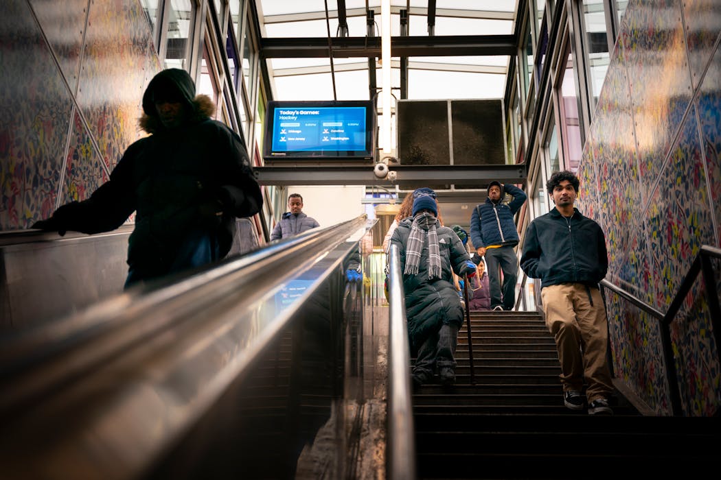 Passengers disembarking from the Blue Line train headed down the steps at the Lake Street/Midtown Station. With broken escalators on both sides and a broken elevator, even passengers with walking impairments have to take the stairs.
