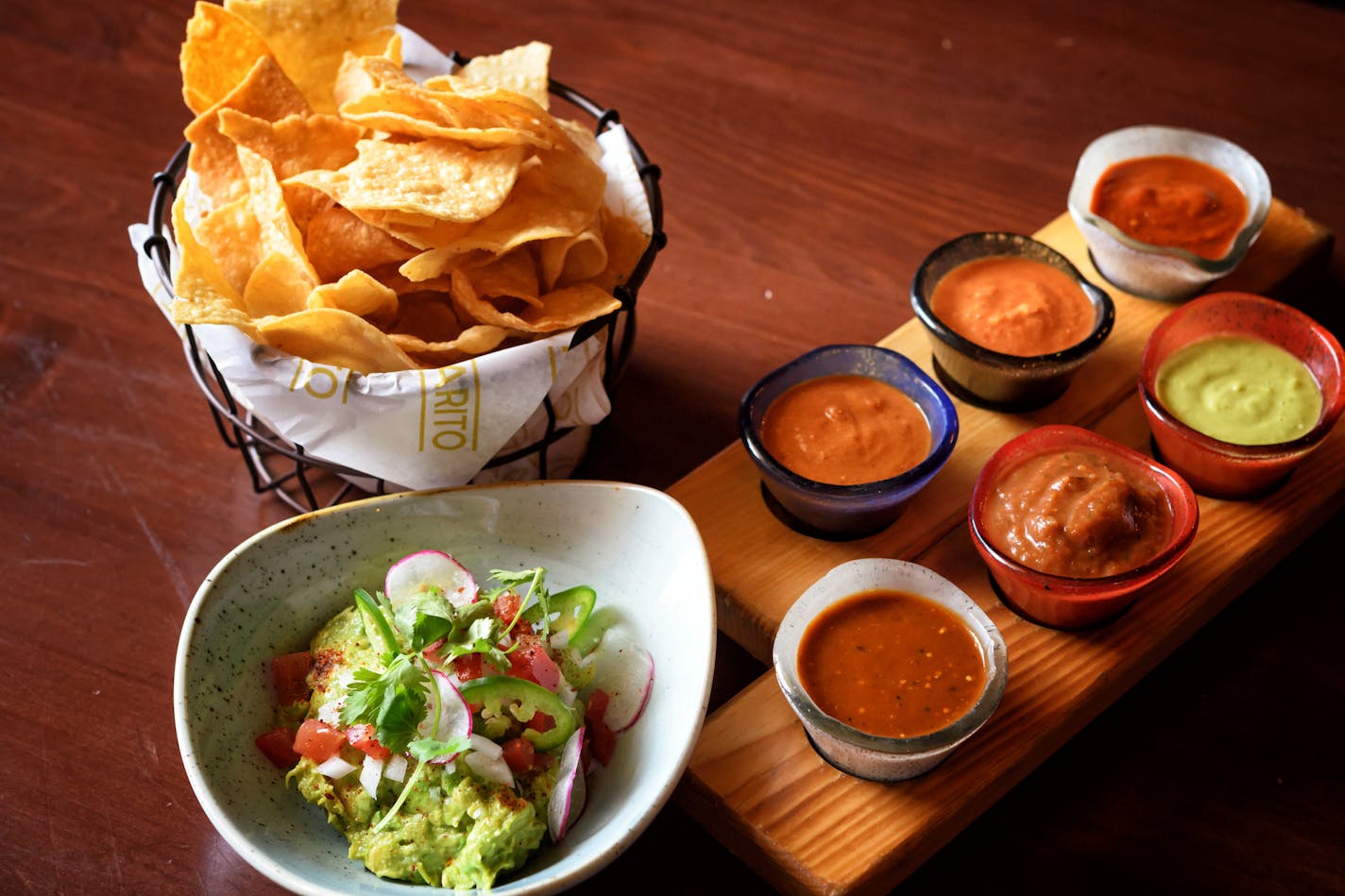 Pajarito's Salsa and chips &#x2014; Ancho-Guajillo, Charred Tomato, Avocado-Serrano, Arbol Cashew, Chipotle, Habanero. Guacamole.