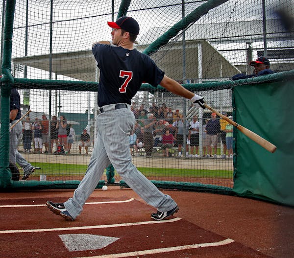 ELIZABETH FLORES &#xa5; eflores@startribune.com February 24, 2010 -Fort Myers, FL IN THIS PHOTO: ] Minnesota Twins Joe Mauer took to the batting cage 