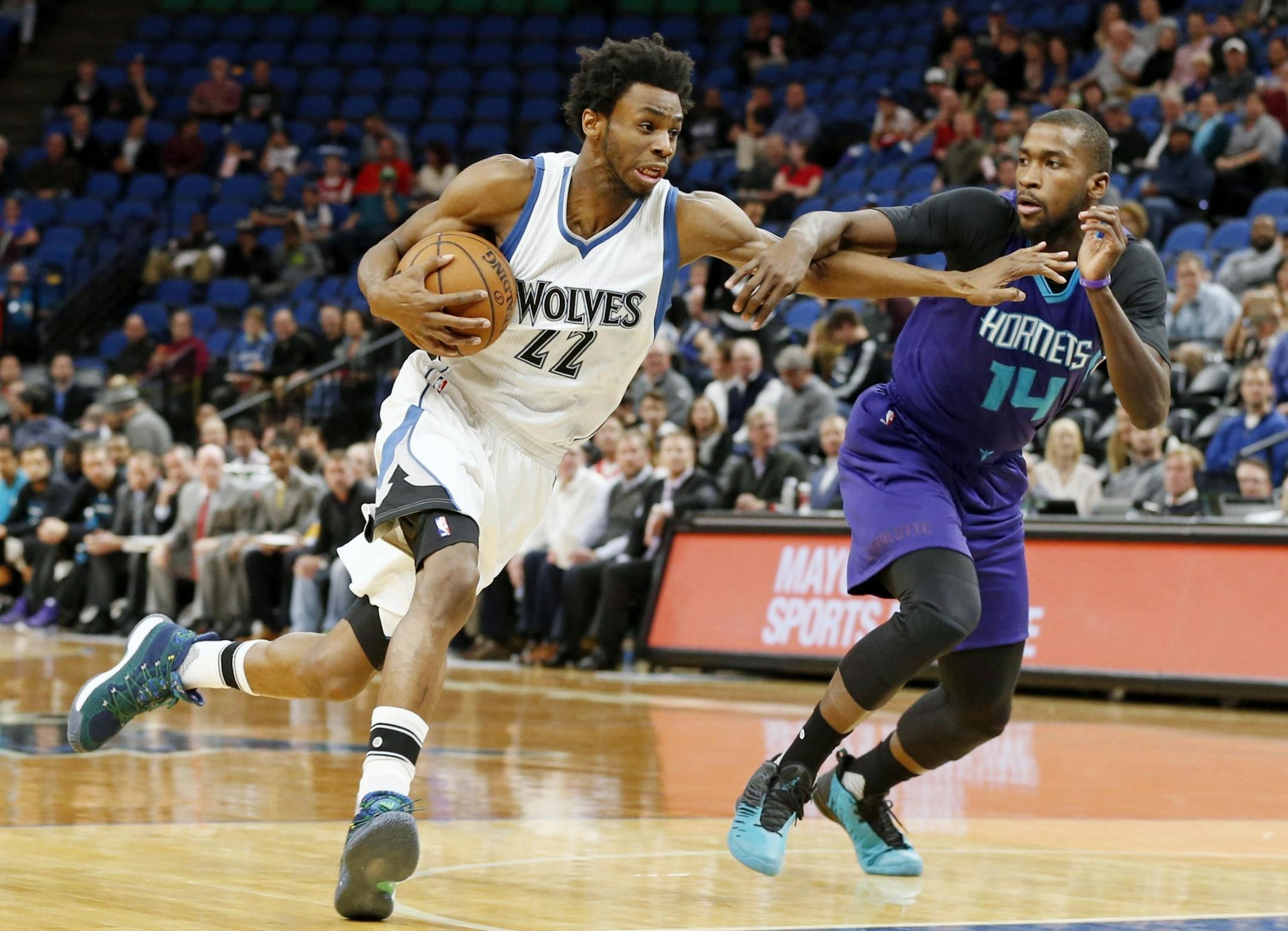 Minnesota Timberwolves' Andrew Wiggins, left, drives on Charlotte Hornets' Michael Kidd-Gilchrist in the first quarter of an NBA basketball game Tuesday, Nov. 15, 2016, in Minneapolis.