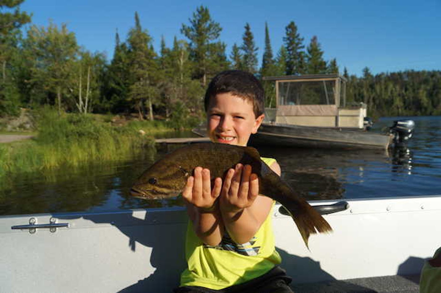 Fishing with his father, Steve, and cousin Mason in the BWCA, 6-year old Ryan Tschetter of Farmington landed a 16-inch smallmouth bass July 22 using a leech and single hook.