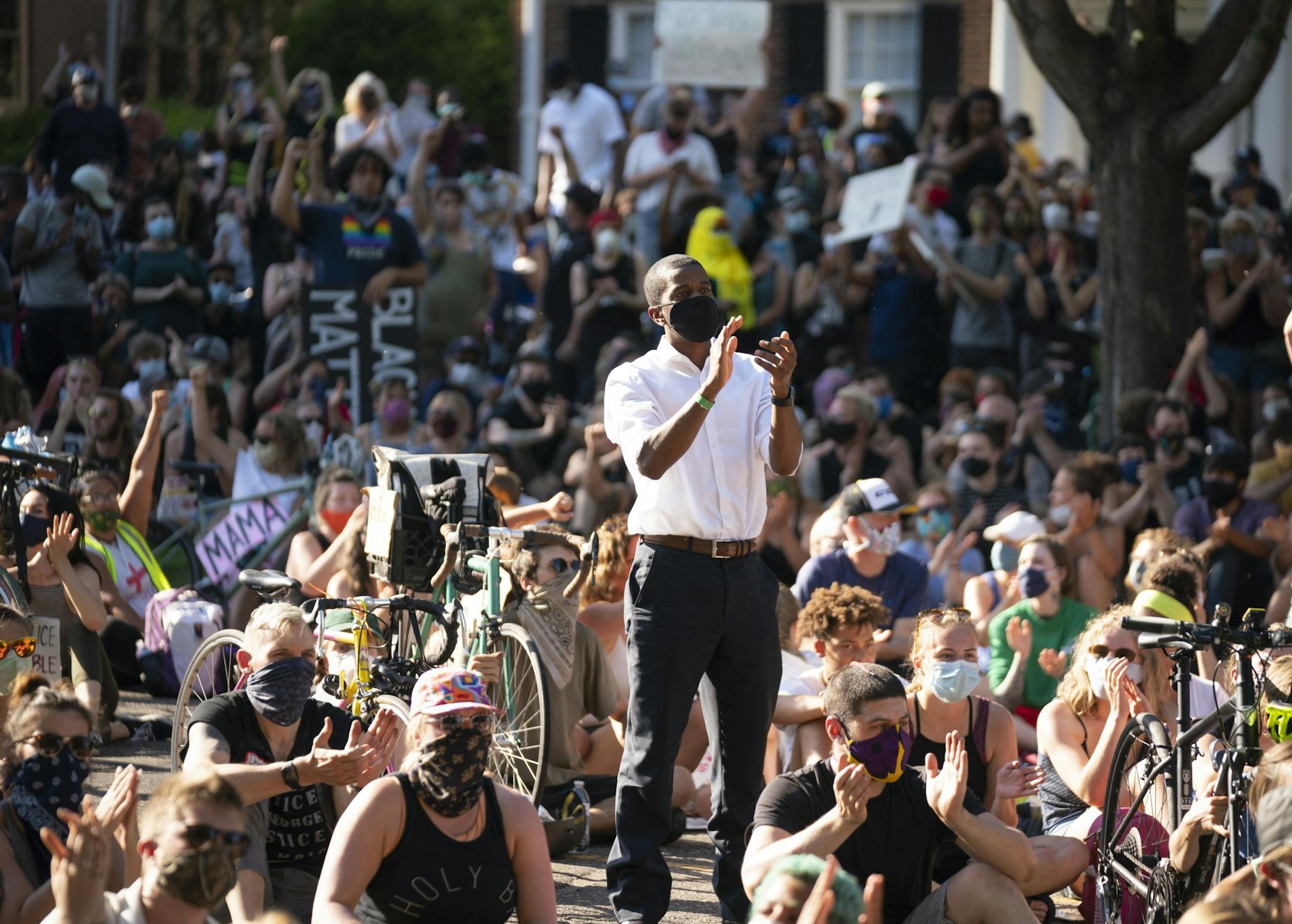 When one of the final speakers, Marques Armstrong, asked all the black men in the crowd on Summit Ave. to stand, St. Paul Mayor Melvin Carter was among those who did..