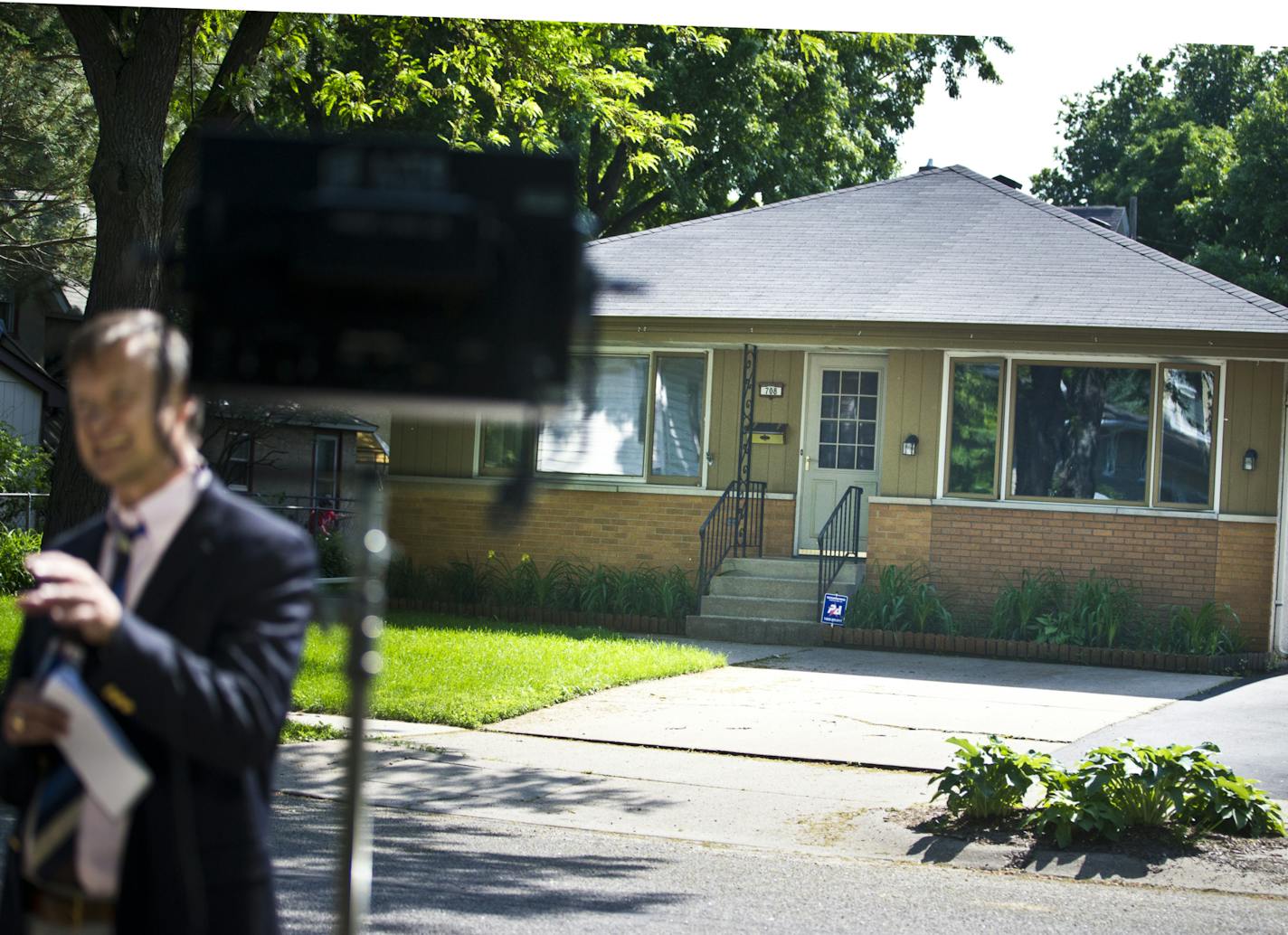 June 14, 2013: News crews did stand-ups outside the home where Michael Karkoc, 94, accused of being a top commander of the SS-led Ukrainian Self Defense Legion, is known to live in Minneapolis, Minn.