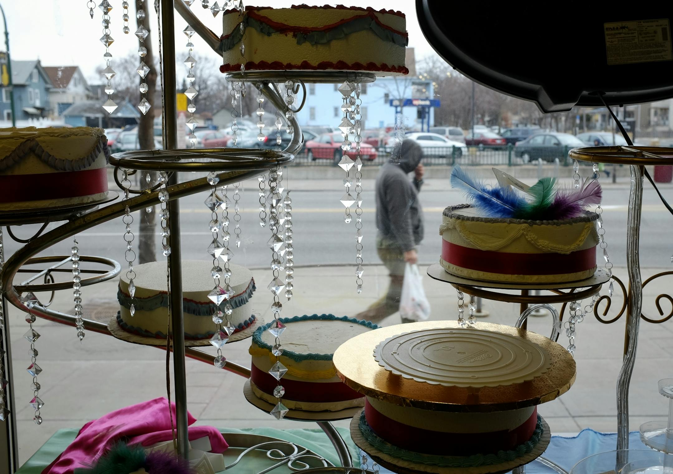 A pedestrian walked along East Lake Street outside of the Midtown Global Market Friday afternoon.