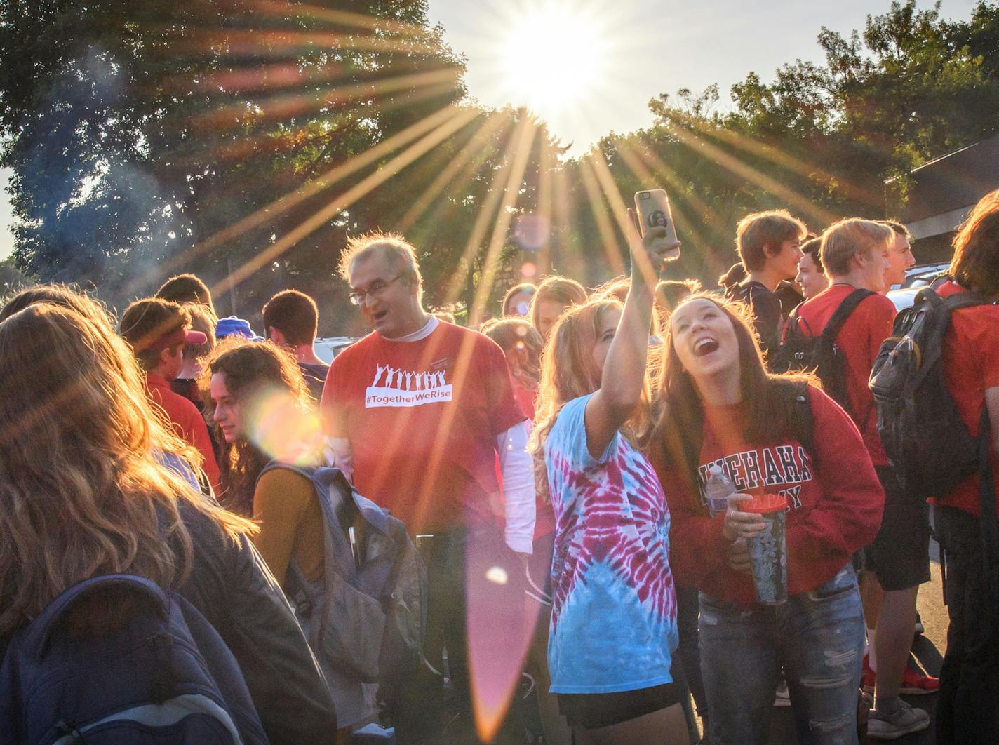 Minnehaha Upper School seniors and some staff members gathered in the parking lot before the first day of school. ] GLEN STUBBE &#x2022; glen.stubbe@startribune.com Tuesday September 5, 2017 First day of school for high school students at Minnehaha Academy in temporary classrooms in Mendota Heights. "Minnehaha Academy held a building dedication service and ribbon cutting ceremony to officially open the doors of its temporary Mendota Campus to Upper School students for the 2017-2018 school year."