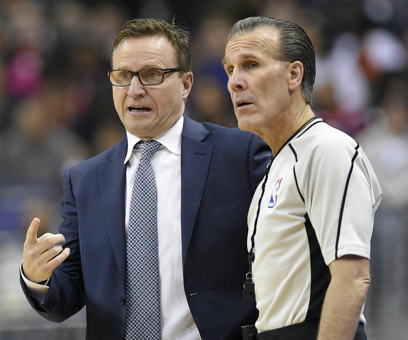 Washington Wizards head coach Scott Brooks, left, talks with referee Ken Mauer (41) during the first half of an NBA basketball game against the Golden State Warriors, Tuesday, Feb. 28, 2017, in Washington. (AP Photo/Nick Wass)