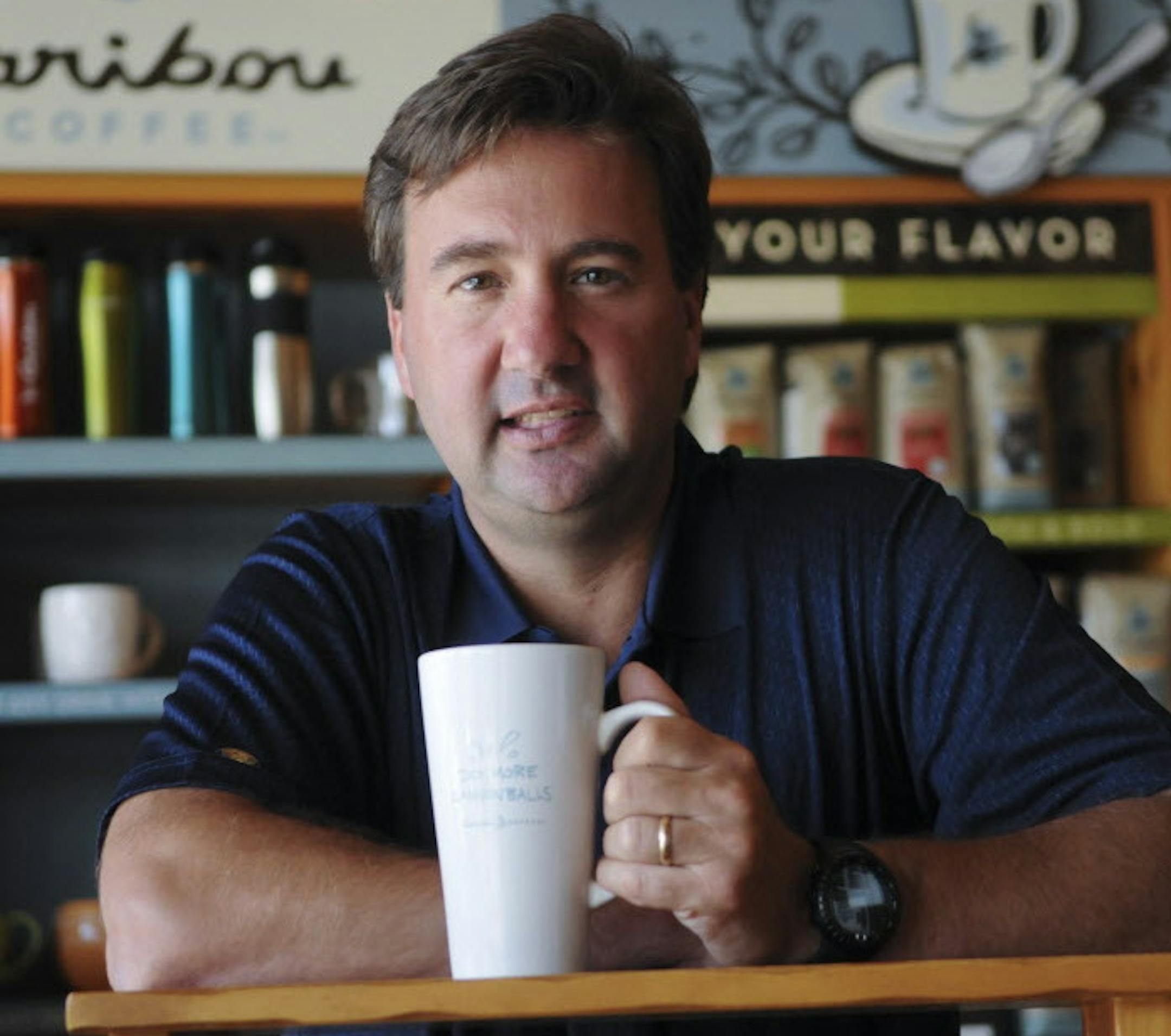 Michael Tattersfield CEO of Caribou Coffee has been leading the company on a path of rapid growth.He talked about the present and future during an interview on Wednesday, 7/6/2011 at Caribou Coffee Headquarters in Brooklyn Center, Minn.This portrait was made in a Caribou Coffee shop attached to the headquarters.] Richard Sennott/Star Tribune. Richard.Sennott@startribune.com Brooklyn Center, Mn. Wednesday 07/06/11) ** Michael Tattersfield (cq)