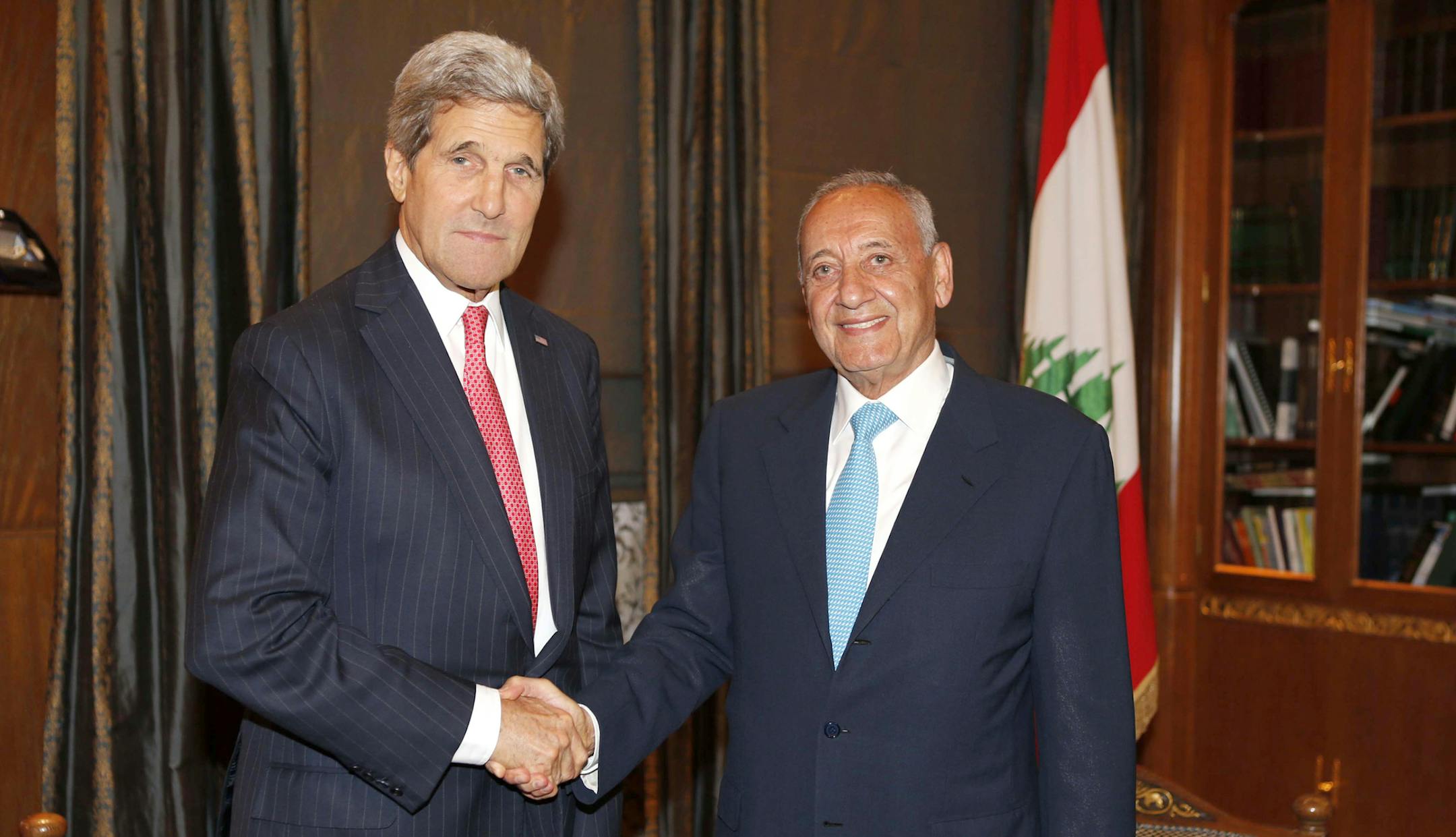 Secretary of State John Kerry shakes hands with Lebanese parliament speaker Nabih Berri in Beirut, Wednesday, June 4, 2014. The political stalemate that has left Lebanon without a president at a turbulent time in the region is "deeply troubling," Kerry said Wednesday. He also announced new aid to cope with the Syrian refugee crisis that has spilled over into its besieged neighbor. (AP Photo/Mohamed Azakir, Pool)
