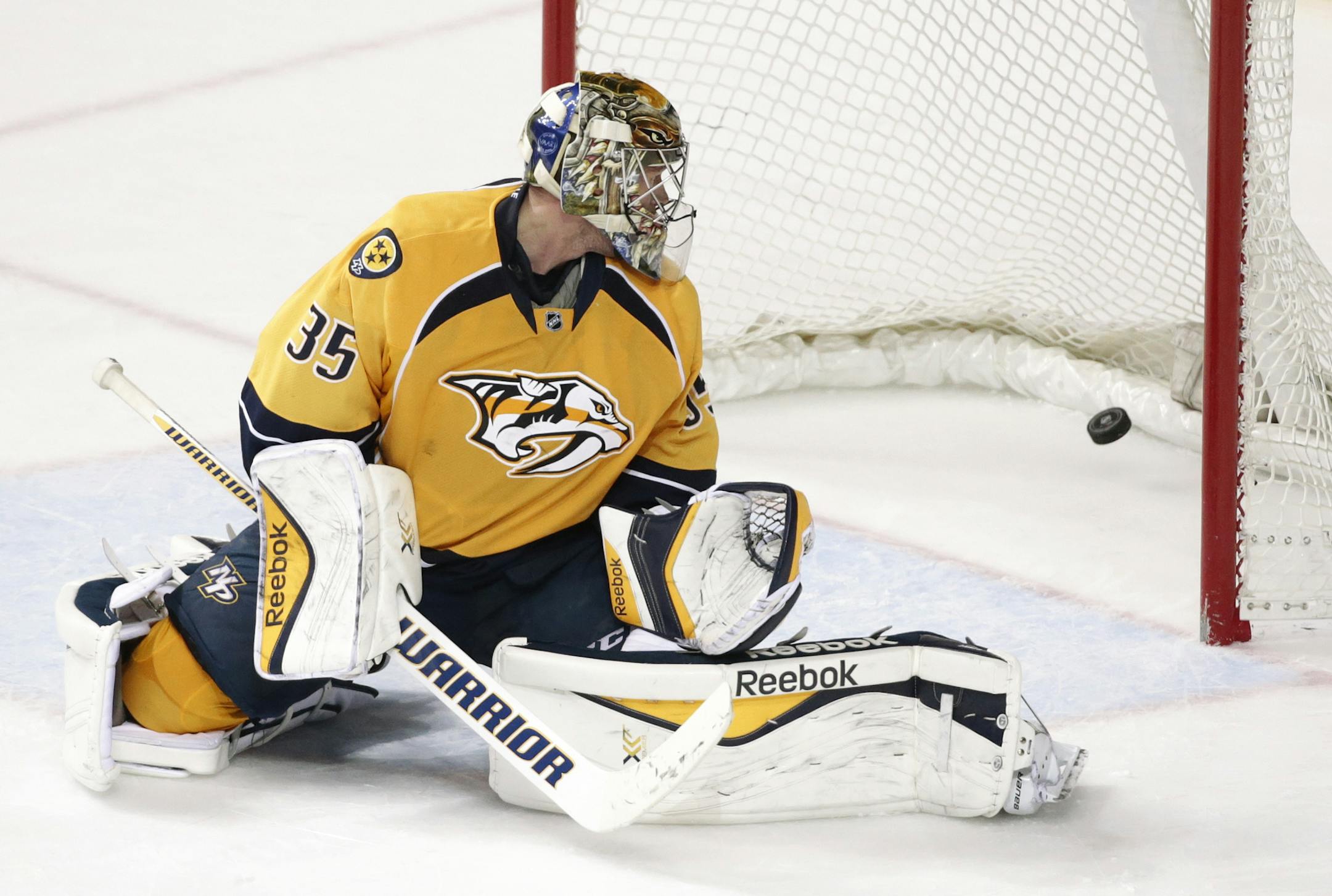 Nashville Predators goalie Pekka Rinne, of Finland, watches as a shot by Minnesota Wild defenseman Matt Dumba gets past for the winning goal in overtime at an NHL hockey game Tuesday, March 17, 2015, in Nashville, Tenn. The Wild won 3-2. (AP Photo/Mark Humphrey)