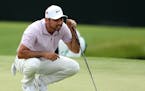 Jason Day lines up his birdie putt on the 15th green during the second round of the Masters Tournament on Friday, April 12, 2019, at Augusta National 