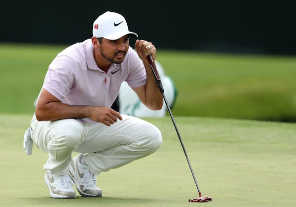 Jason Day lines up his birdie putt on the 15th green during the second round of the Masters Tournament on Friday, April 12, 2019, at Augusta National 