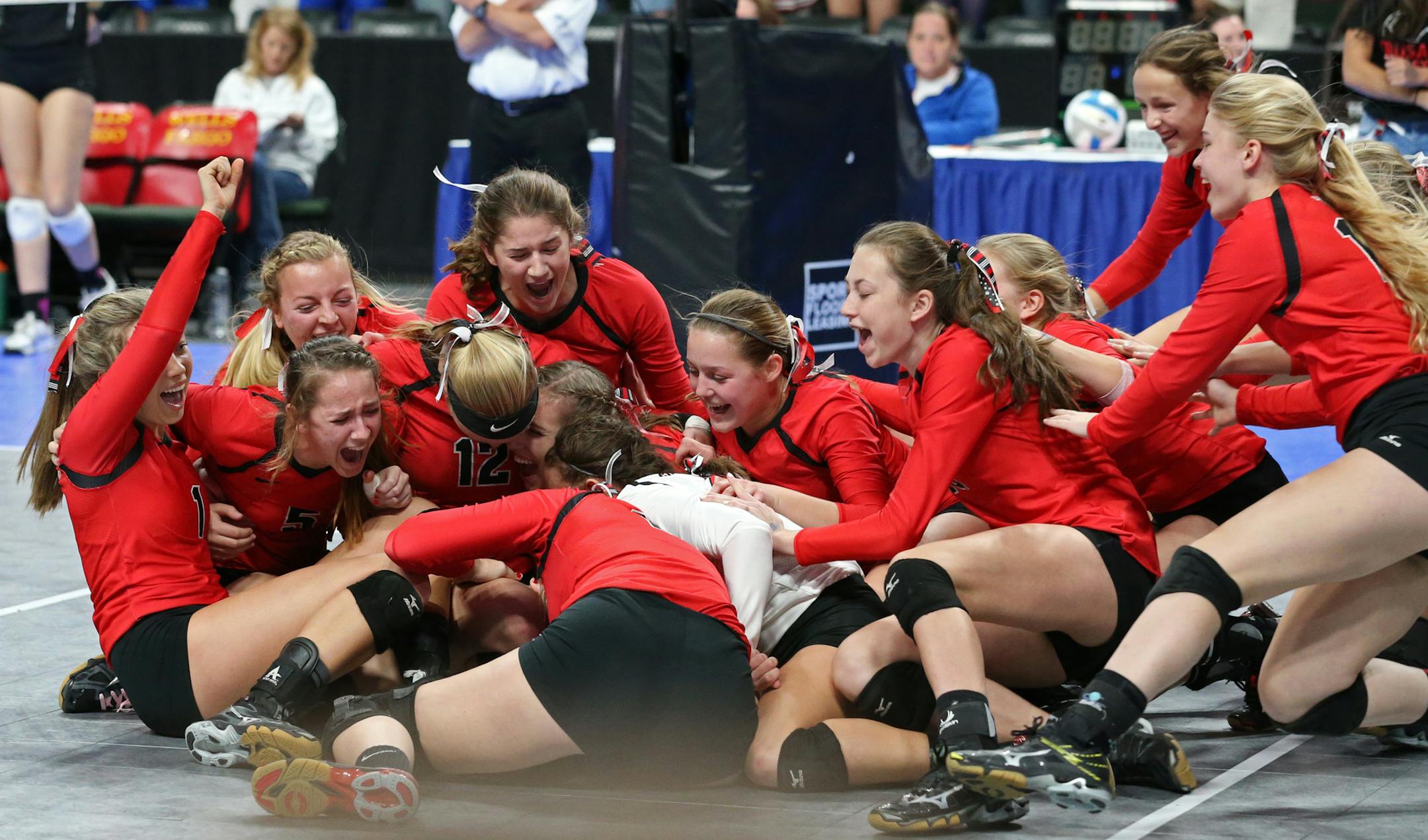 Mayer Lutheran celebrated their 3-1 game win over Caledonia in the class 1A championship. ] Mayer Lutheran defeated Caledonia three games to one in the finals match of the state high school class 1A volleyball tournament on Saturday, November 12, 2016 at the Xcel Energy Center in St. Paul, Minn.