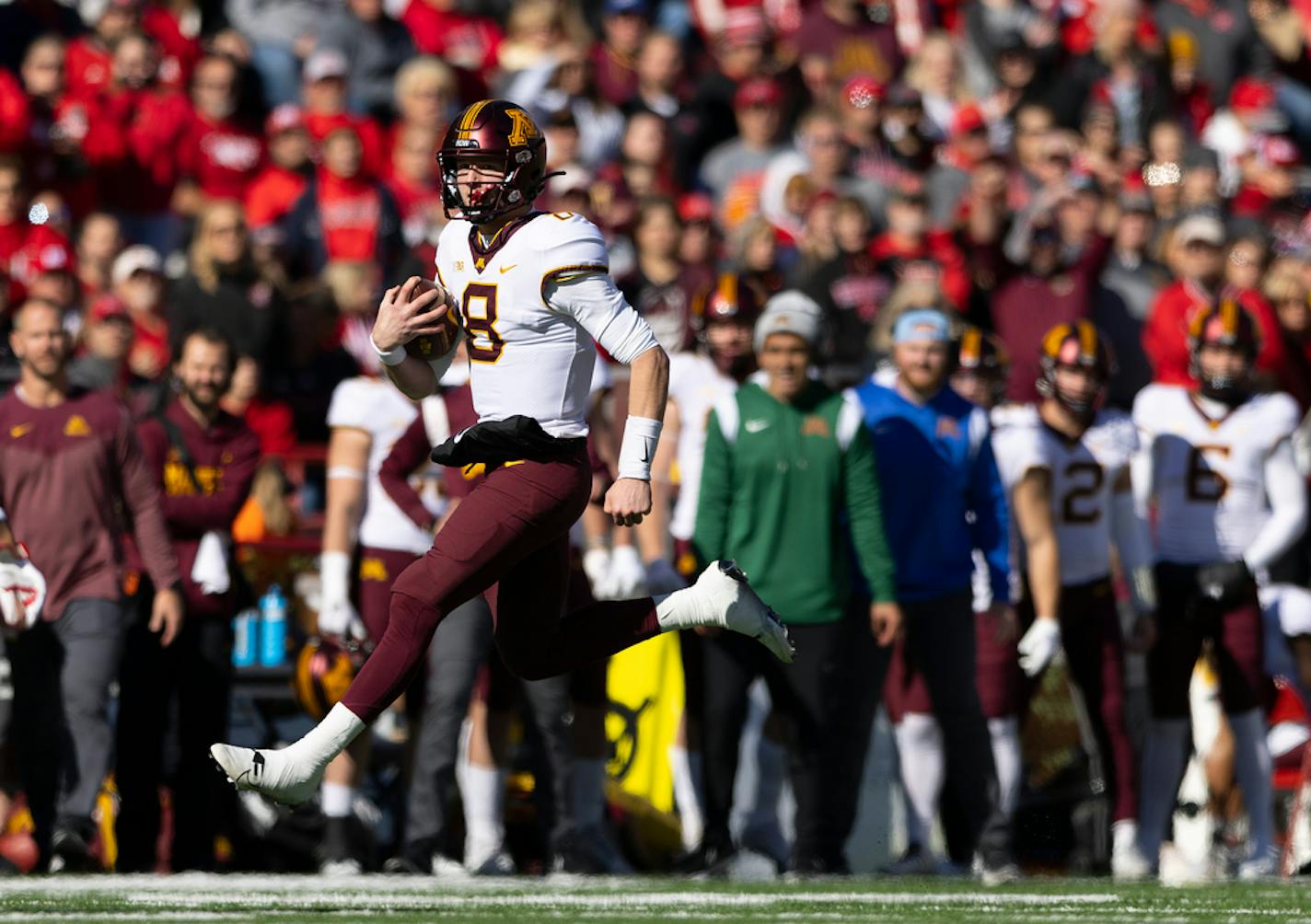 Minnesota quarterback Athan Kaliakmanis (8) rushes against Nebraska.