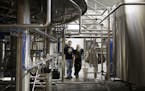 Surly Brewing Co.'s founder and president Omar Ansari, left, and brewery operations director Todd Haug inside their brewery in southeast Minneapolis.