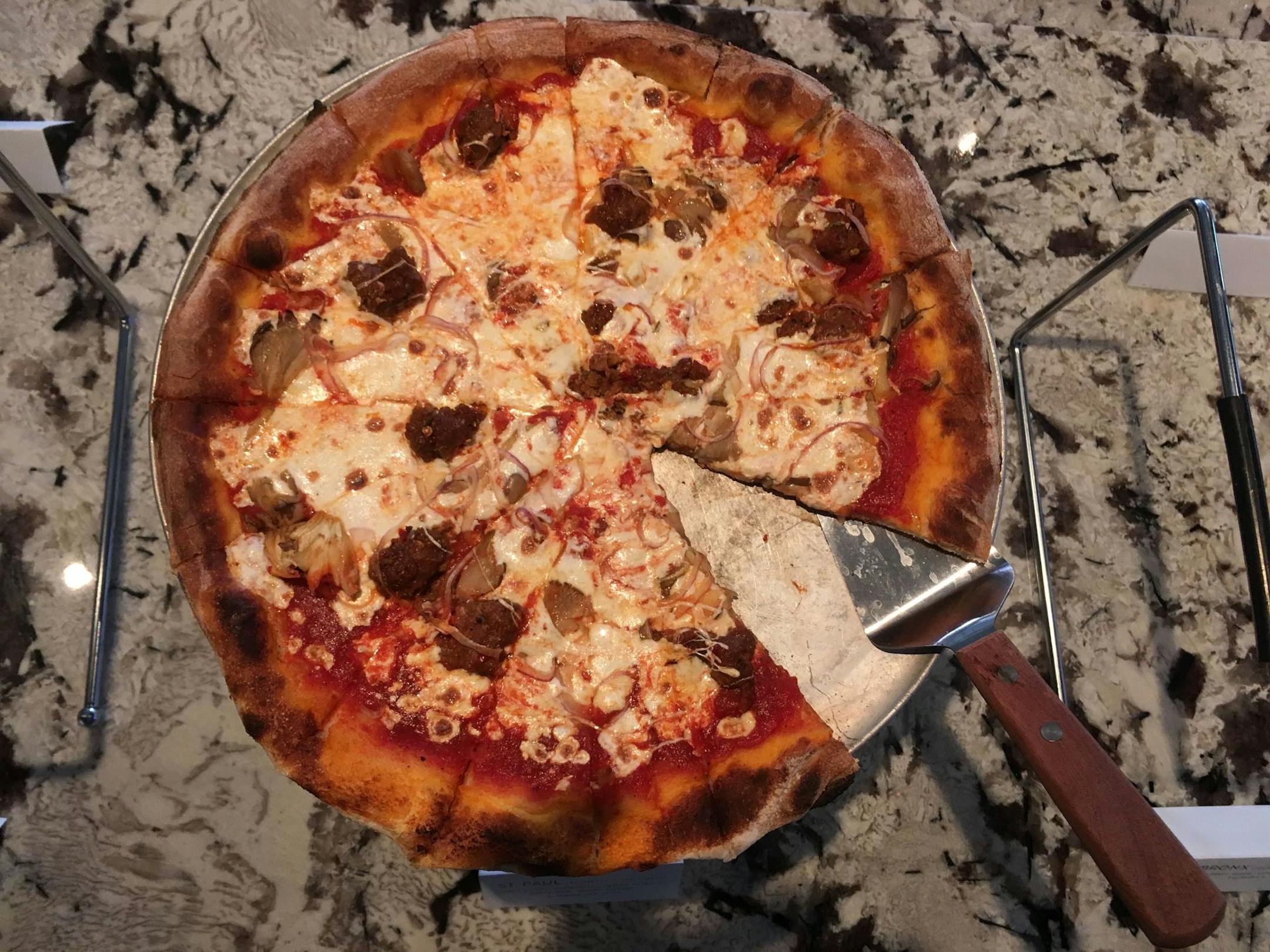 The St. Paul is a pizza at the Fitz topped with oyster mushroom, house-made fennel sausage and shaved red onion.