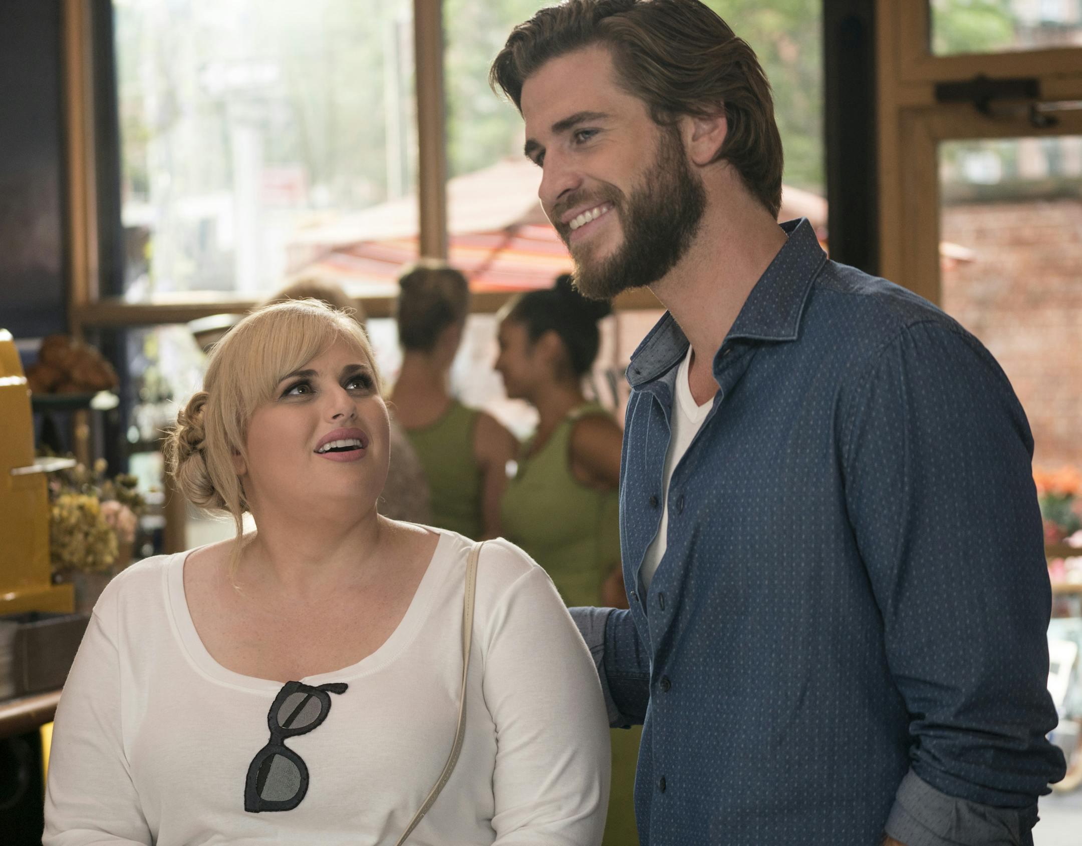 IIR-10862 Film Name: ISN'T IT ROMANTIC Copyright: &#xa9;2019 WARNER BROS. ENTERTAINMENT INC AND BRON CREATIVE USA, CORP. Photo Credit: Michael Parmelee Caption: (L-R) REBEL WILSON as Natalie and LIAM HEMSWORTH as Blake in New Line Cinema's comedy "ISN'T IT ROMANTIC," a Warner Bros. Pictures release.