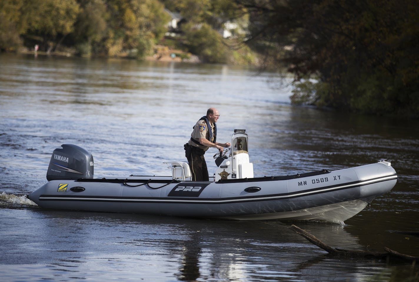 An officer with the Anoka County Sheriff's Department drives his boat to shore after divers recovered the crashed plane. ] LEILA NAVIDI &#xef; leila.navidi@startribune.com BACKGROUND INFORMATION: Lt. Brent Erickson of the Anoka County Sheriff's Department speaks during a press conference at Mississippi Point Park in Champlin on Sunday, October 15, 2017. A small plane crashed in the Mississippi River near Ramsey on Friday evening, and a woman pulled from the water died. The Anoka County Sheriff's