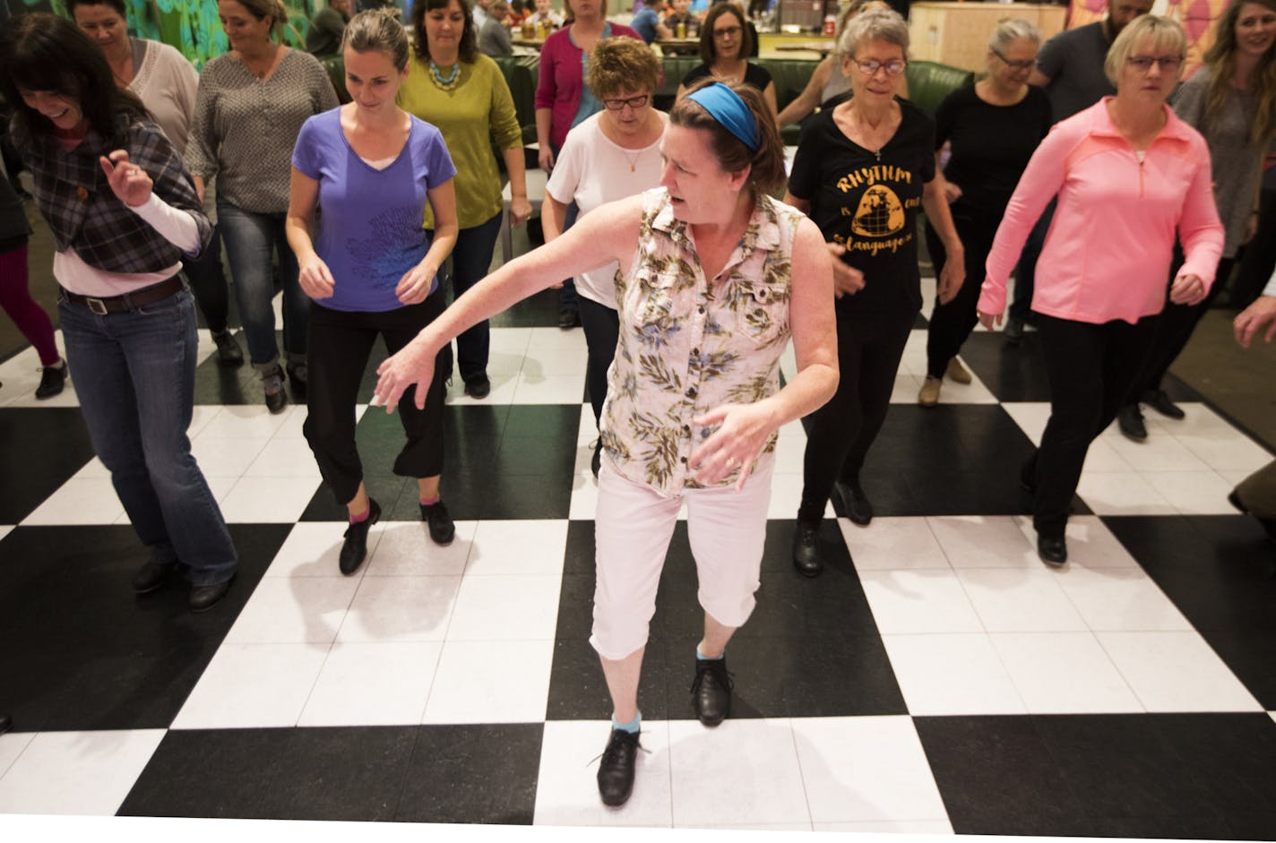 Dance instructor Ellen Keane led Tappy Hour on a recent Friday at Can Can Wonderland in St. Paul. "Anyone can pick up the stuff we're doing," she said. Class varies from week to week.