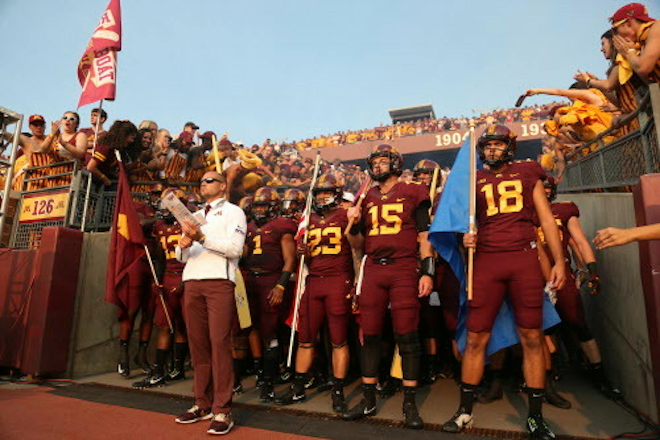 Minnesota head coach P.J. Fleck stands in front of his team prior to an NCAA college football game against Buffalo, Thursday, Aug. 31, 2017, in Minneapolis. Minnesota won 17-7. (AP Photo/Stacy Bengs)