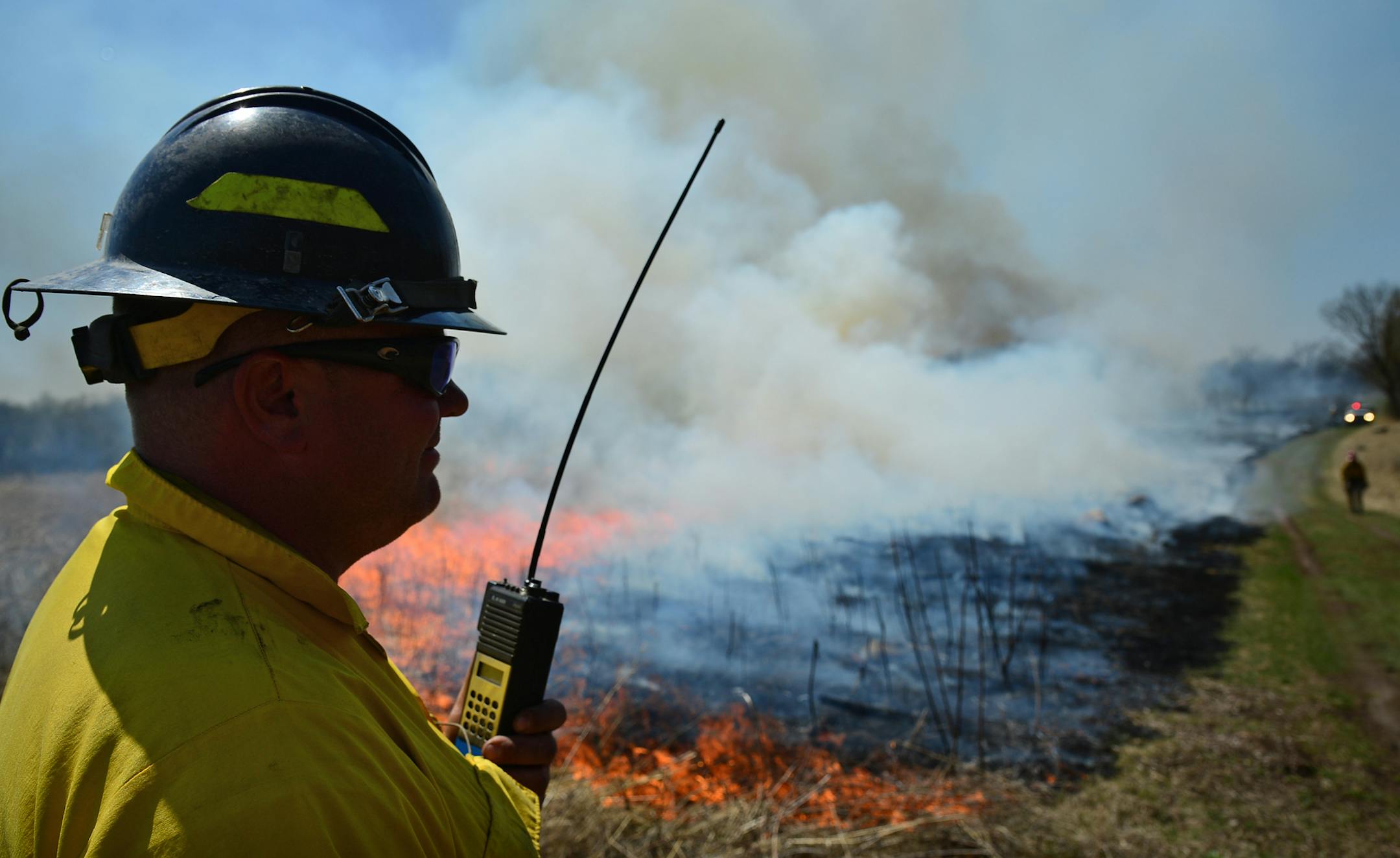 Jason Oxford of the Bloomington Fire Department kept in close contact with fire crews during the burn.