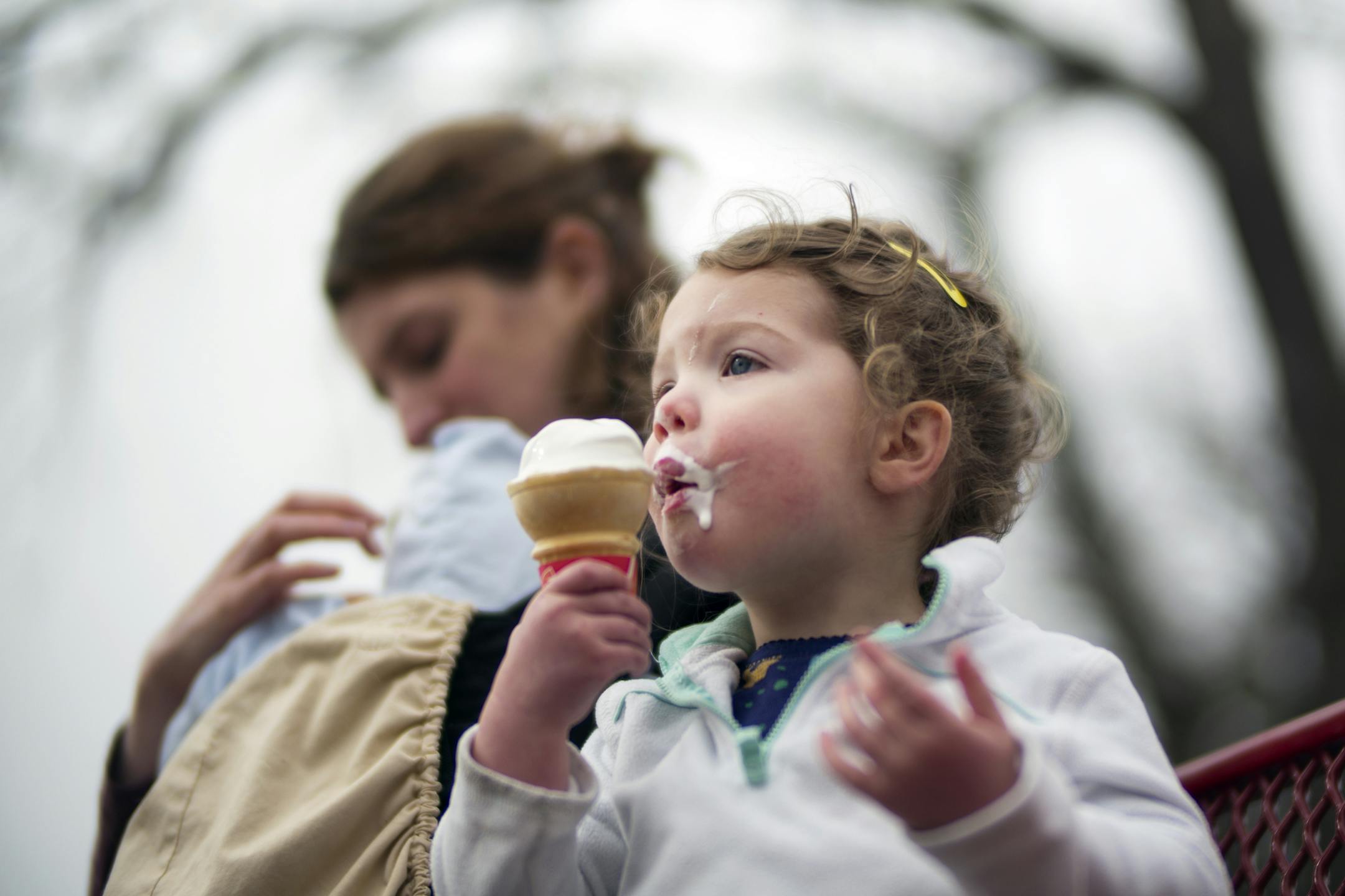 At the Dairy Queen on East Lake St., Alex Vitrella watched as daughter Maya,2, was enjoying her free ice cream cone thanks to a give away celebrating the company's 75th anniversary .]Richard Tsong-Taatarii/rtsong-taatarii@startribune.com
