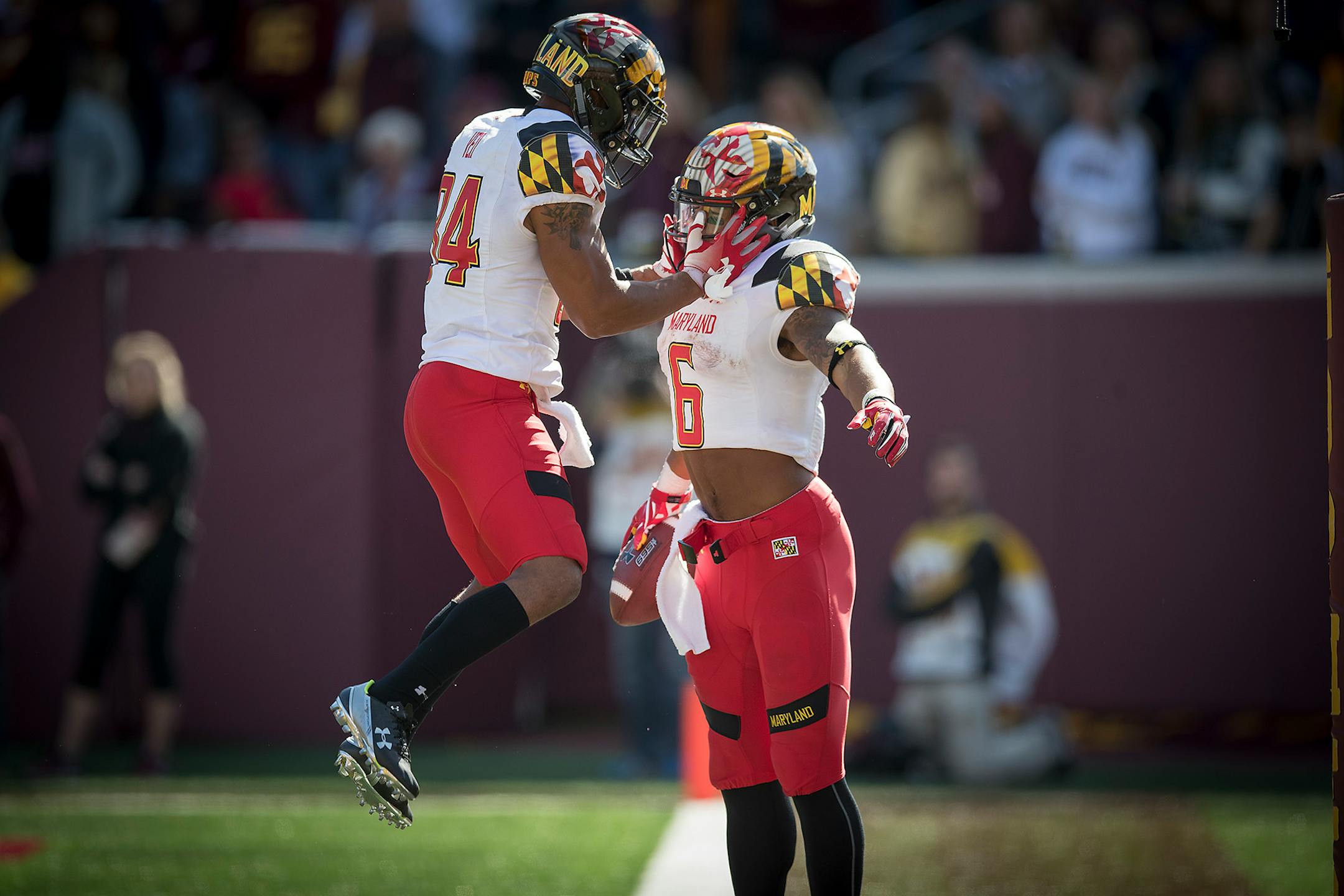 Maryland wide receiver Jacquille Veii celebrates with running back Ty Johnson, who ran 34 yards for a touchdown with 1:10 to play in the fourth quarter against Minnesota