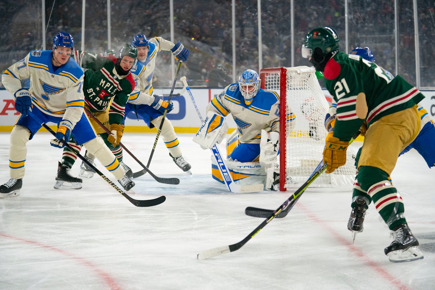 St. Louis Blues goaltender Jordan Binnington (50) prepares for a cross by Minnesota Wild right wing Brandon Duhaime (21) in the first period of the 2022 Winter Classic Saturday, Jan. 01, 2022 in Minneapolis, Minn. ]