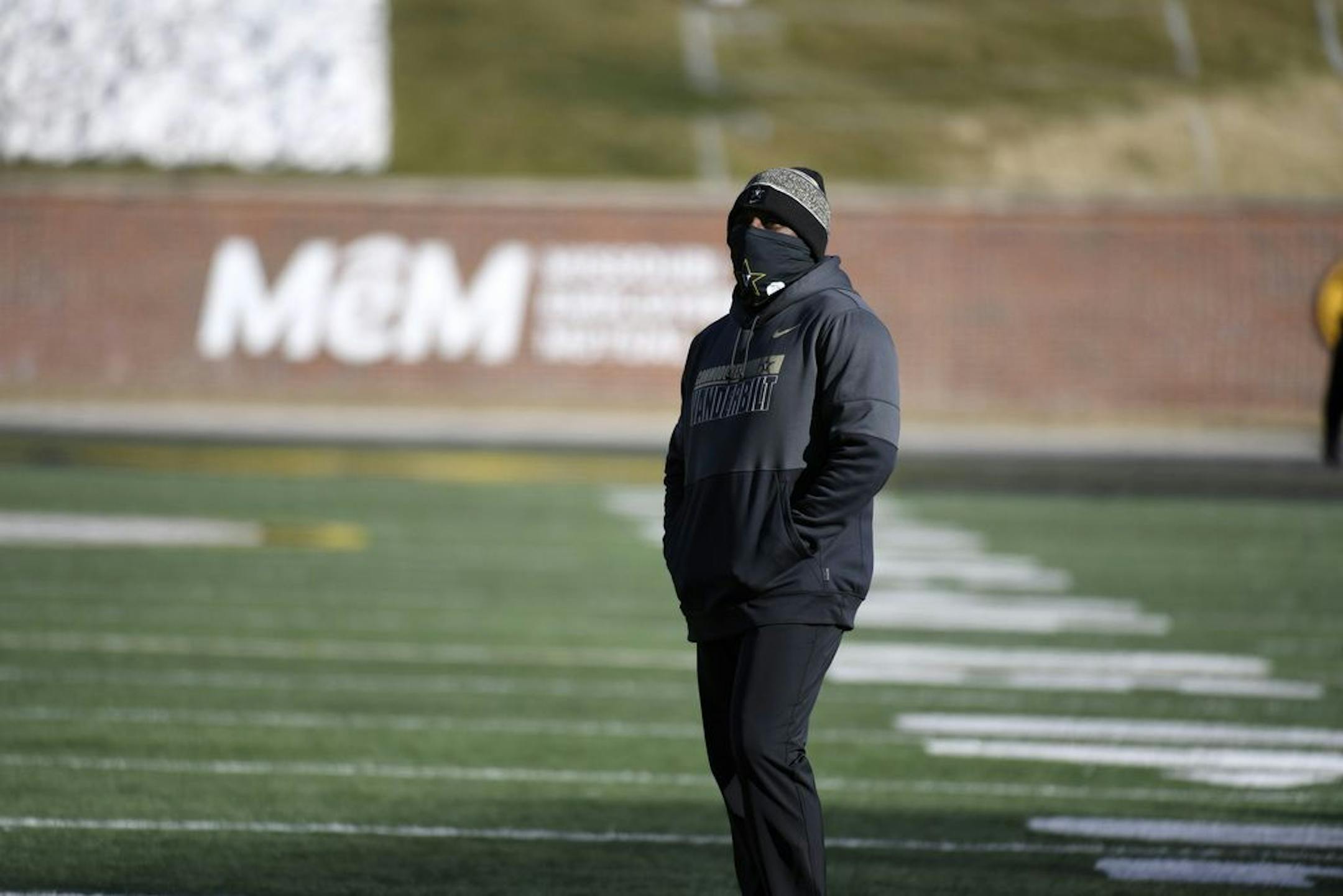 Vanderbilt head coach Derek Mason watches his team warm up before the start of an NCAA college football game against Missouri Saturday, Nov. 28, 2020, in Columbia, Mo.