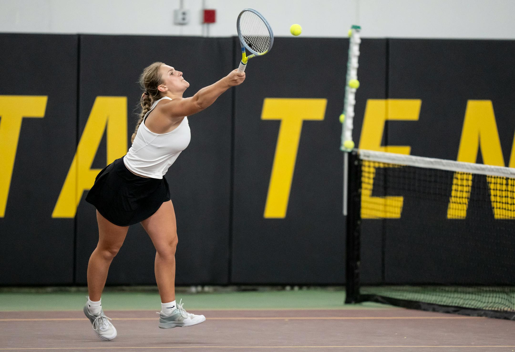 Third doubles player Livia Walseth hits the ball while playing Elk River with partner Keira Aho during the Class 2A team girls tennis quarterfinals.