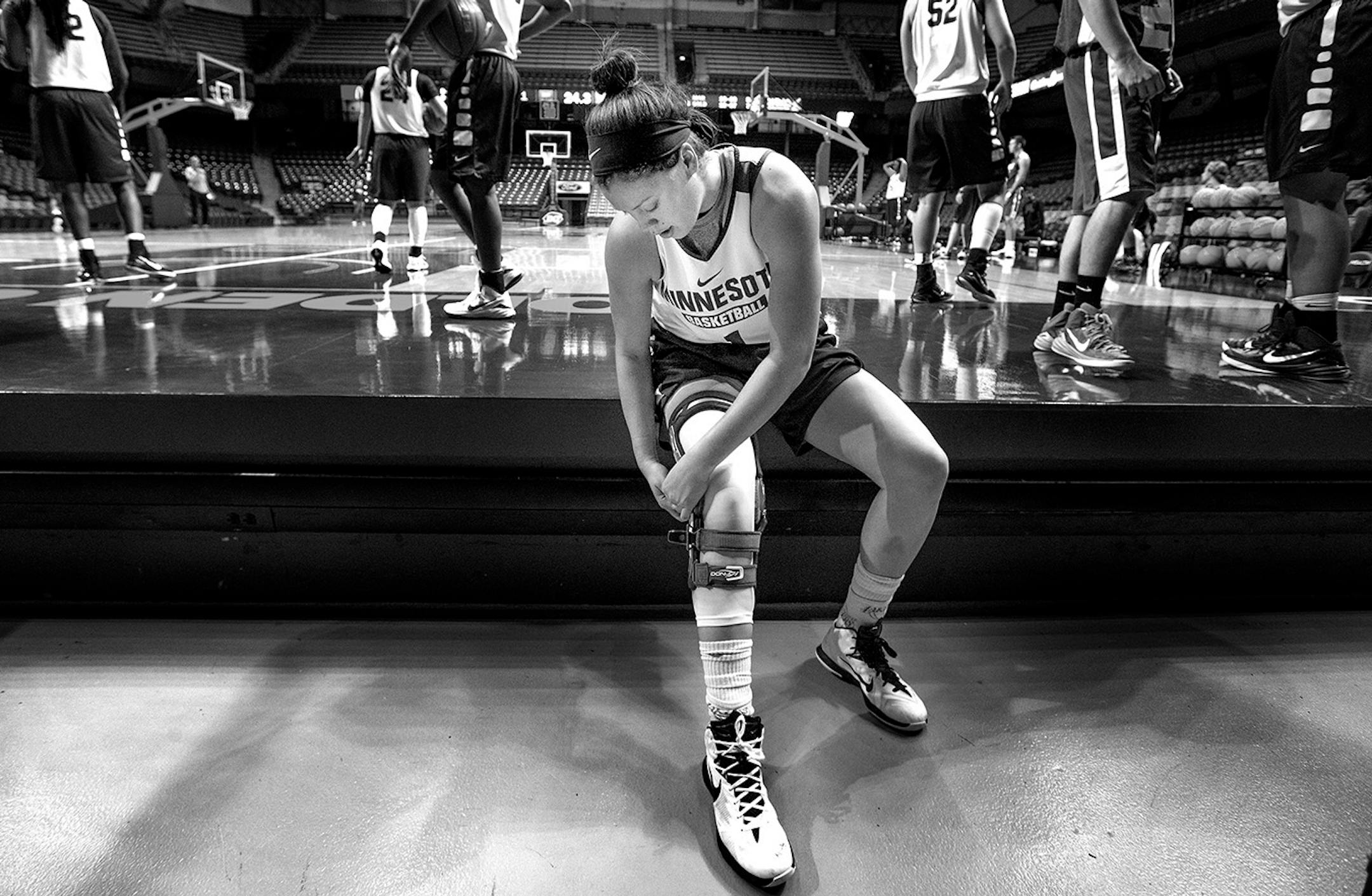 Felling some discomfort with a new knee brace Rachel Banham swapped it for an old one during a practice at Williams Arena on October 29, 2015.