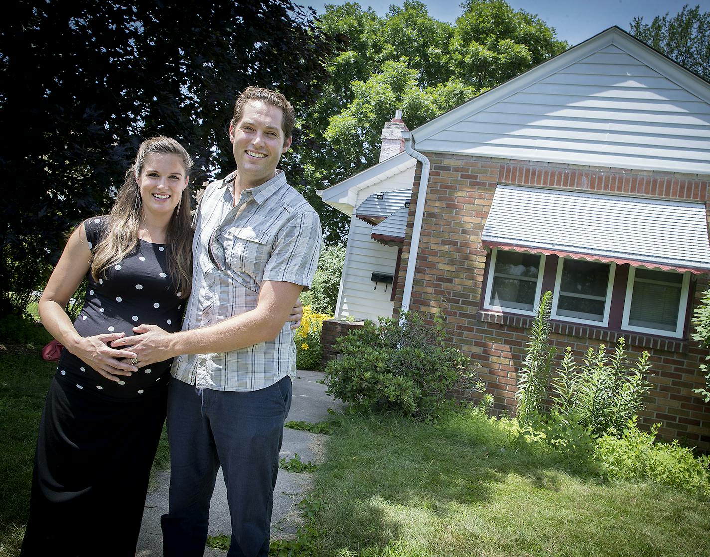 Chris Iles and his wife Tinen Iles, cq, at the home that they rent to others, Friday, June 29, 2018 in Minneapolis, MN. The couple decided to trade up from this small, but well-kept house in the Longfellow neighborhood to a bigger one in the area. Rising rents and increasing house prices recently helped convince them to keep the house in Longfellow as a rental rather than sell it. ] ELIZABETH FLORES &#xef; liz.flores@startribune.com