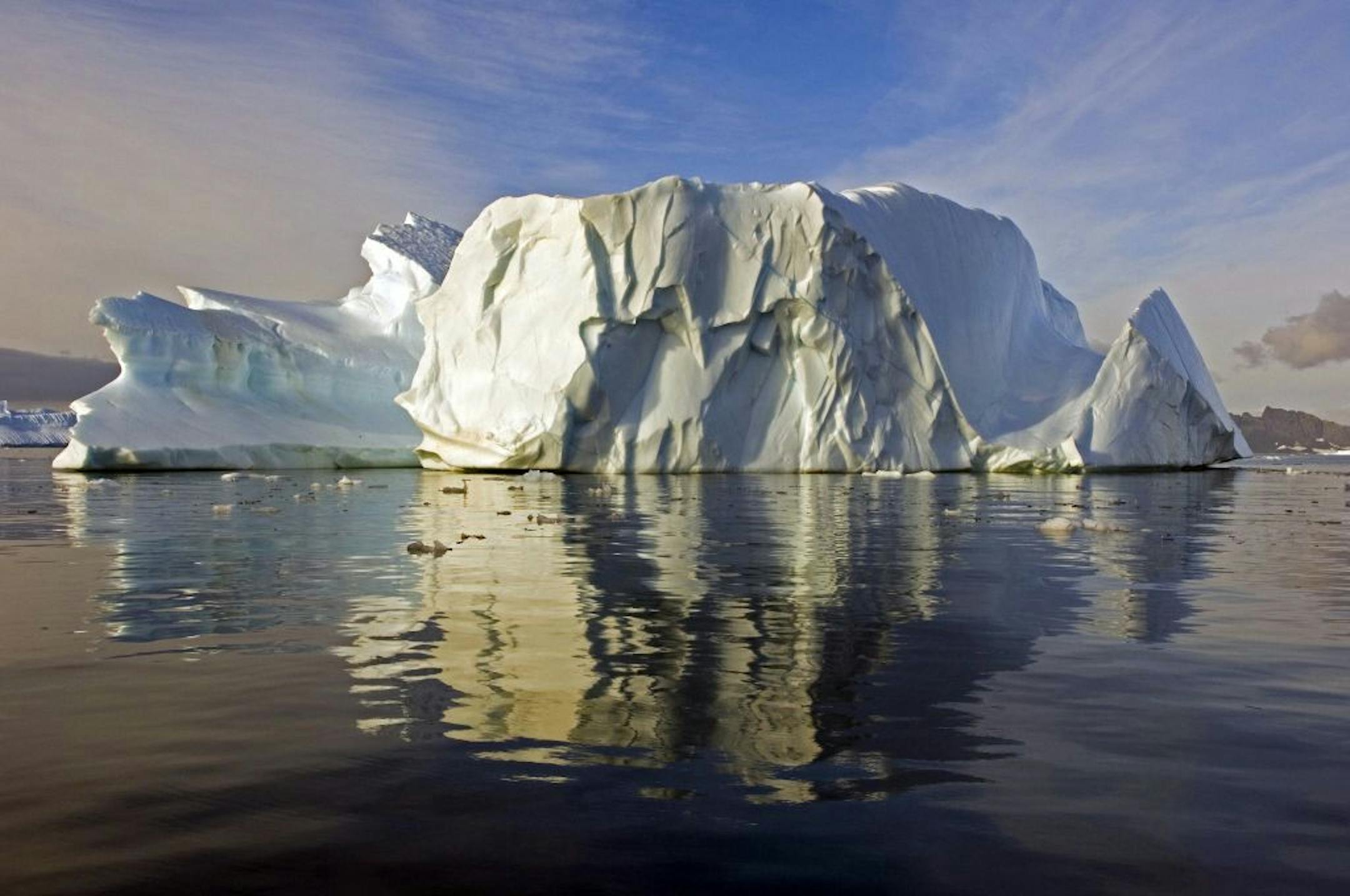 A sculptured iceberg in North Bay, Rothera Point, Adelaide Island, Antarctica. Shrinking sea ice is significantly increasing the rate at which icebergs scour the Antarctic seabed.