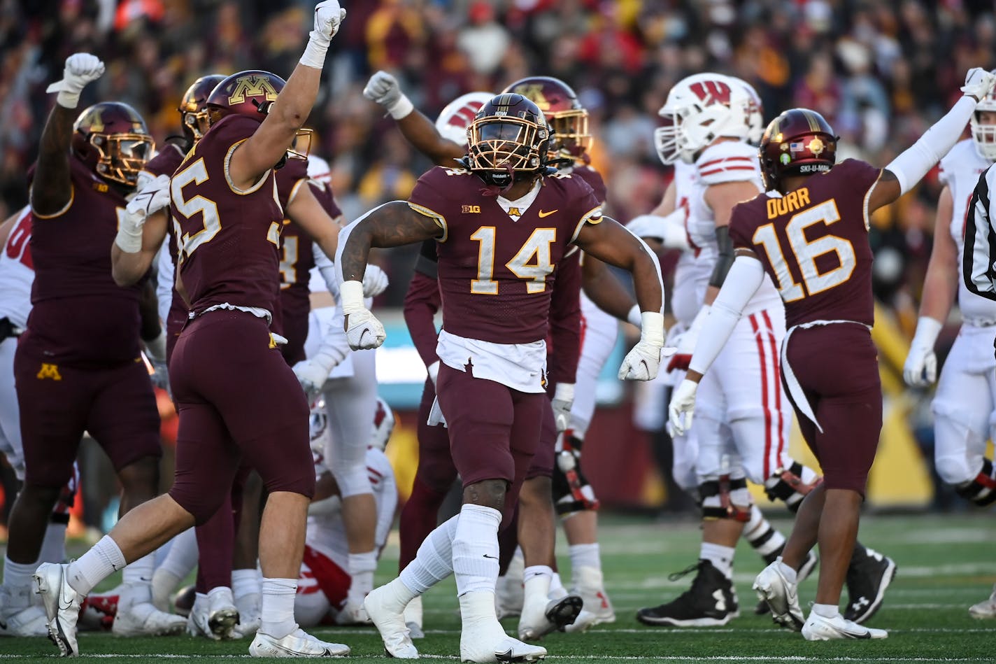 Minnesota Gophers linebacker Braelen Oliver (14) celebrates a third down stop, which was then ruled a first down on forward progress during the first quarter of an NCAA football game between the Minnesota Gophers and the Wisconsin Badgers Saturday, Nov. 27, 2021 at Huntington Bank Stadium in Minneapolis, Minn. ] AARON LAVINSKY • aaron.lavinsky@startribune.com