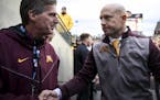 Gophers head coach P.J. Fleck shook hands with University of Minnesota Athletic Director Mark Coyle following his team's 40-17 win against Illinois, b
