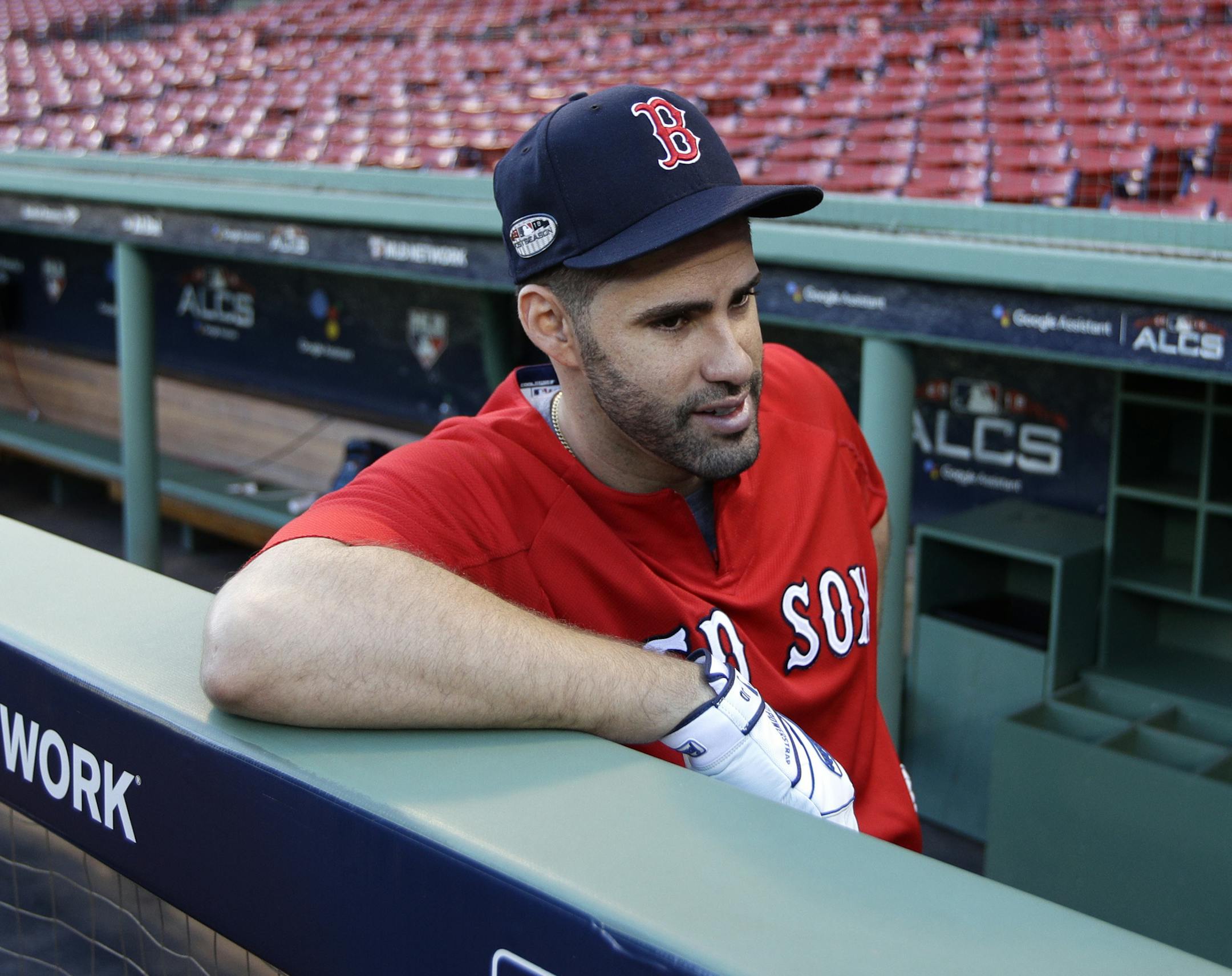 Boston Red Sox's J.D. Martinez speaks to a reporter during a workout at Fenway Park, Friday, Oct. 12, 2018, in Boston. The Red Sox face the Houston Astros in Game 1 of baseball's American League Championship Series on Saturday. AP Photo/Elise Amendola)