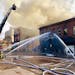 Duluth firefighters worked to quell flames in a three-story building downtown Saturday, Nov. 21.