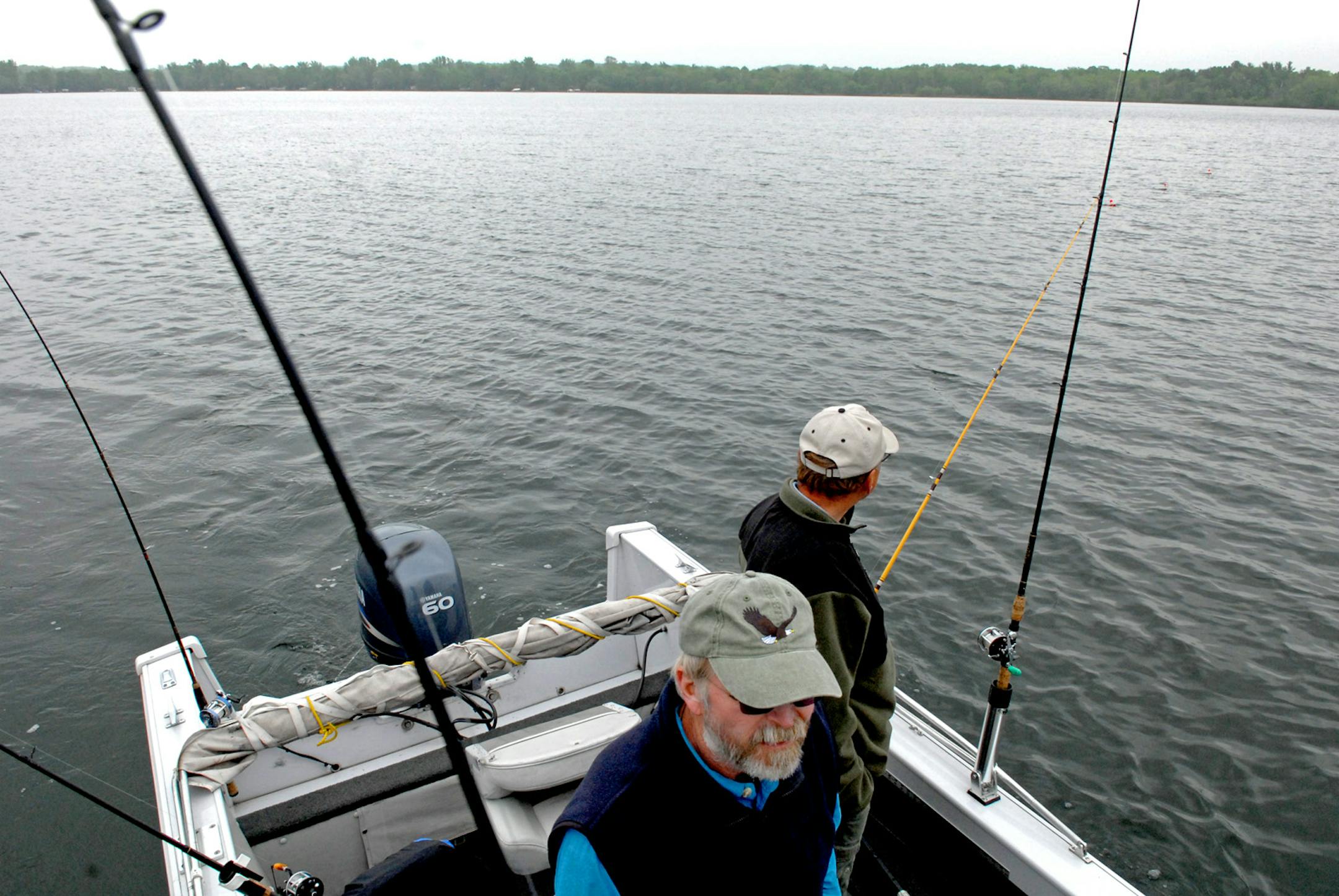 Gary Gehrman, foreground, of Stillwater, and Dan Weiss of Marine on St. Croix, trolled slowly — very slowly — on Cedar Lake in Wisconsin last week, seeking walleyes using planing boards.