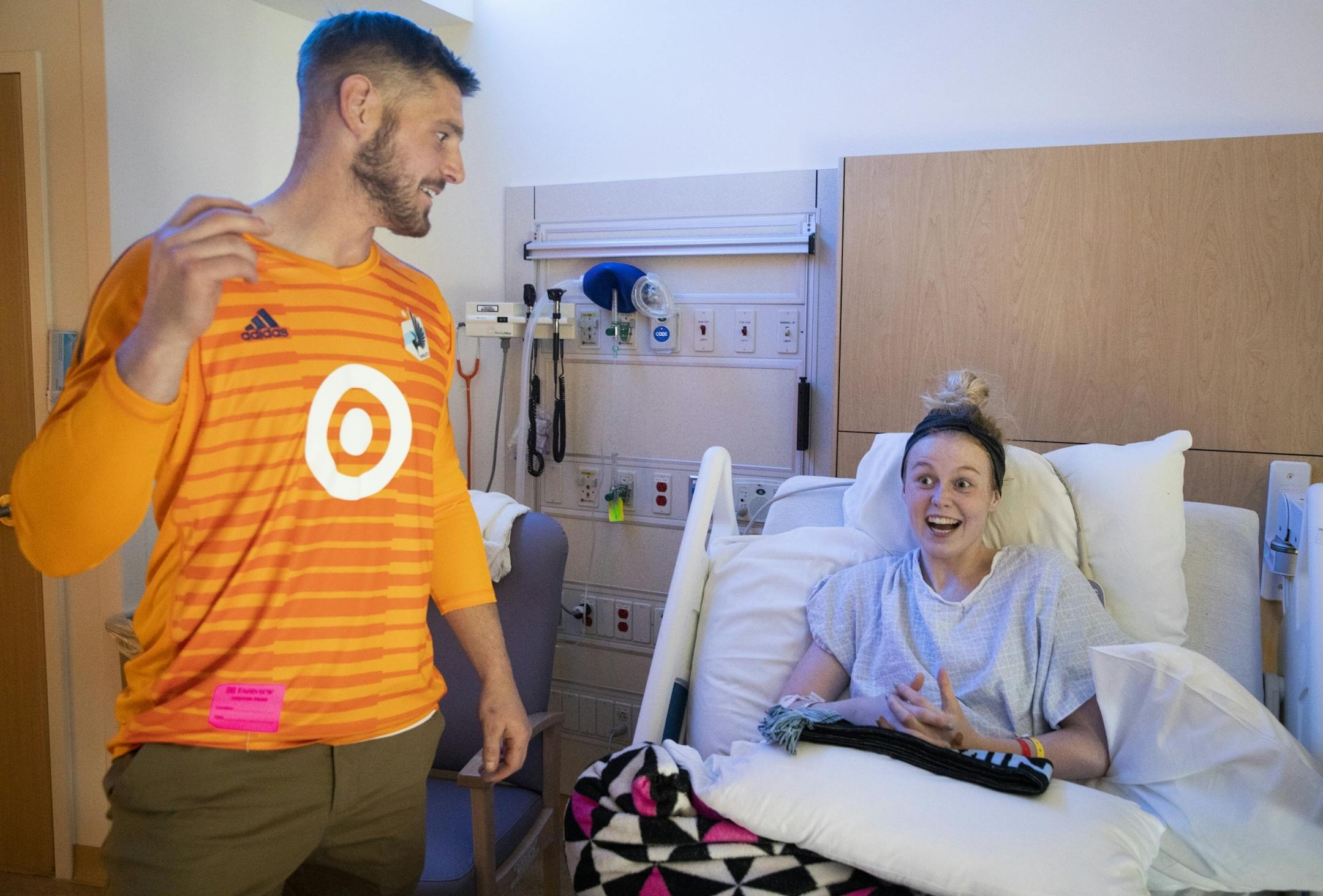 Cassidy Clifton, 17, who just had a tumor removed from her spine, reacts when she hears she will get free tickets to a Minnesota United game from goalkeeper Matt Lampson.