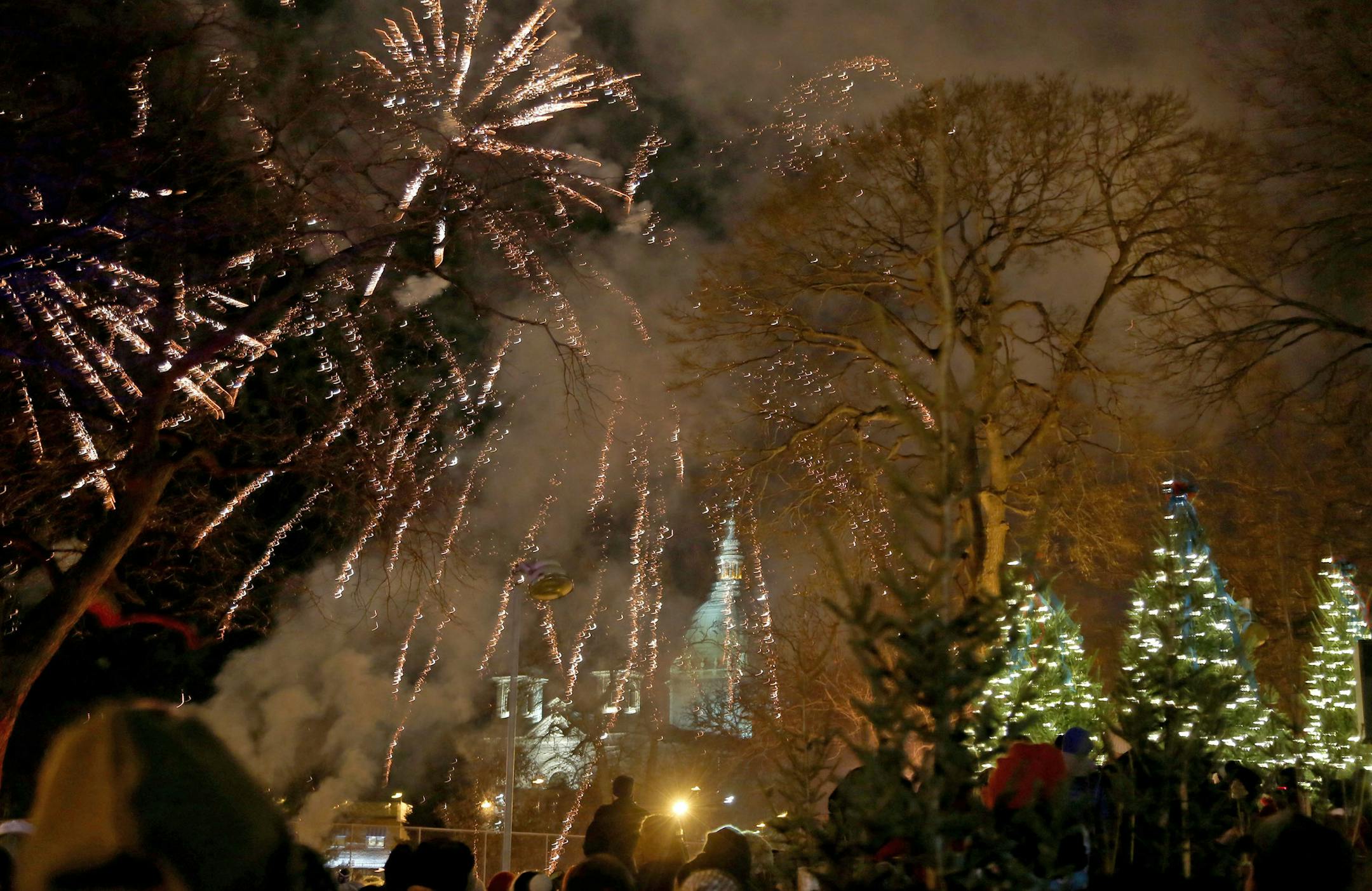 Holidazzle kicked off tonight for the holiday season at Loring Park with fireworks Friday, Nov. 27, 2015, in Minneapolis, MN. Behind the park and fireworks is Basilica of St. Mary.](DAVID JOLES/STARTRIBUNE)djoles@startribune.com Holidazzle kicked tonight for the holiday season with fireworks at Loring Park Friday, Nov. 27, 2015, in Minneapolis, MN.
