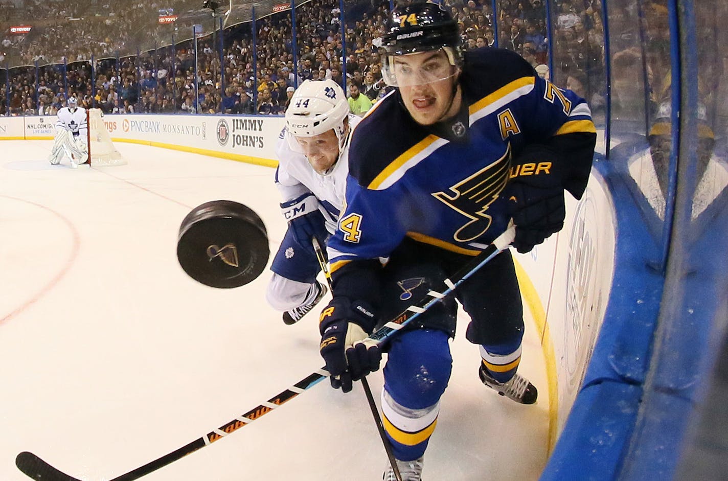 The St. Louis Blues' T.J. Oshie, right, competes for the puck against the Toronto Maple Leafs' Morgan Rielly in the third period on Saturday, Jan. 17, 2015, at the Scottrade Center in St. Louis. The Blues won, 3-0. (Chris Lee/St. Louis Post-Dispatch/TNS)