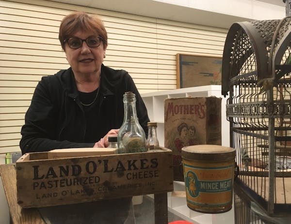 Lin Strong, a director of the Chisago County Historical Society, with artifacts that will be on display in the new headquarters.