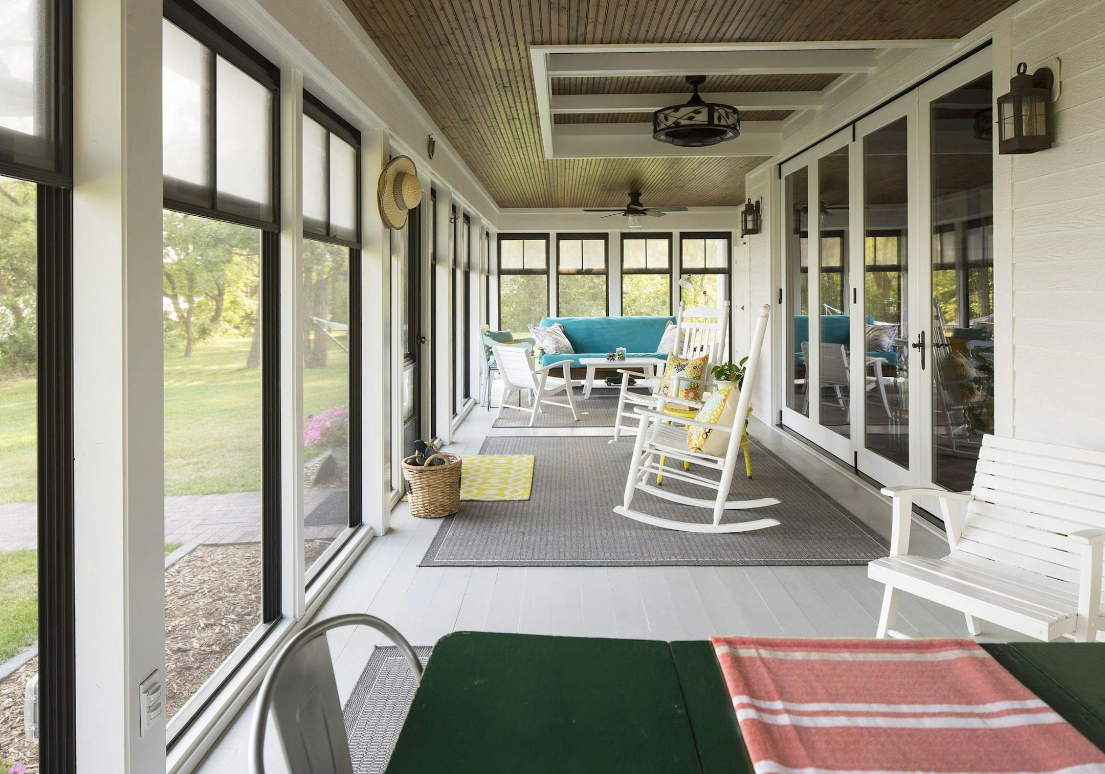 The welcoming three-season front porch faces Swan Lake.
