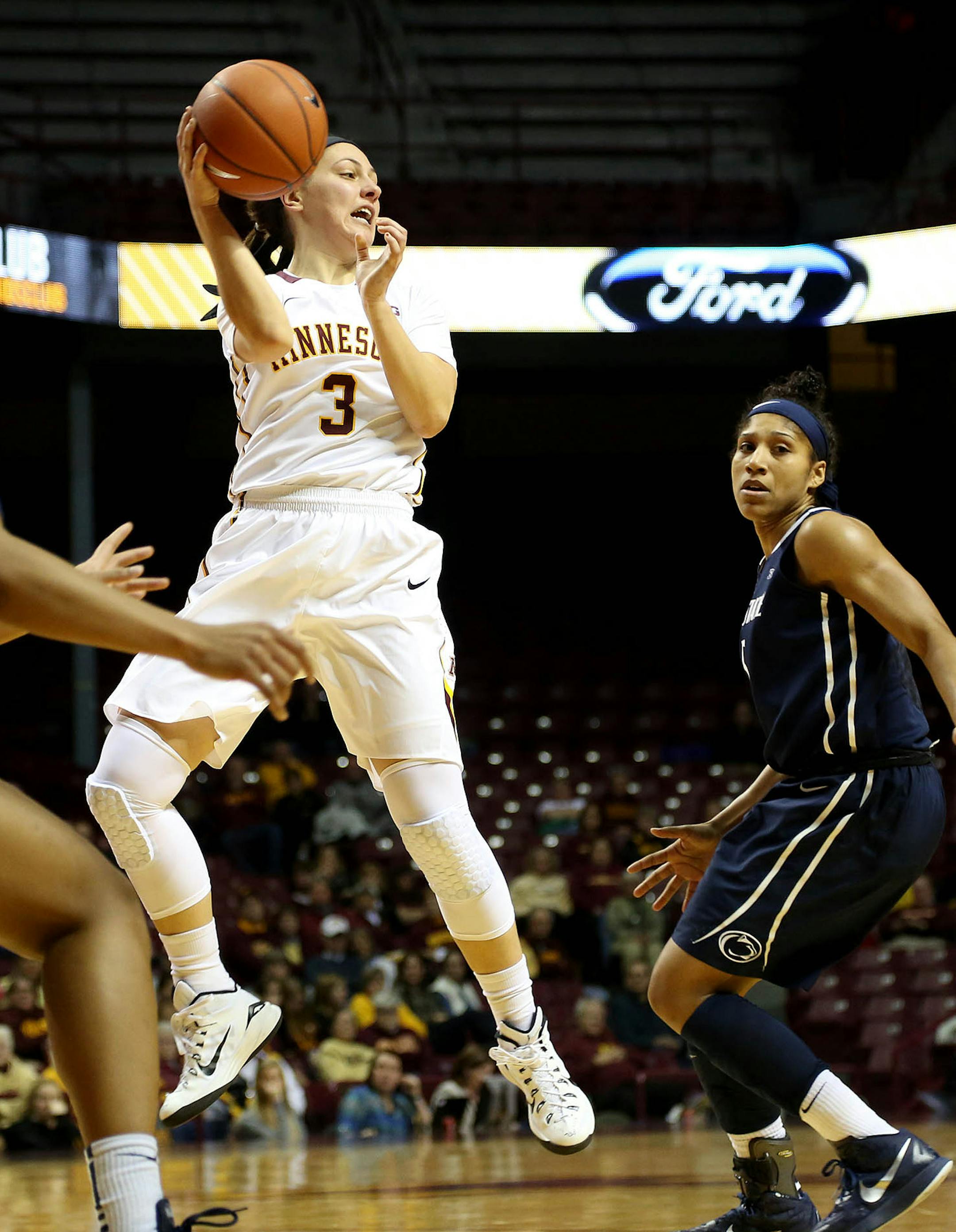 Gopher Shayne Mullaney passed the ball out after cutting to the basket during the first half. ] (KYNDELL HARKNESS/STAR TRIBUNE) kyndell.harkness@startribune.com Gophers vs Penn State at Williams Arena in Minneapolis Min., Wednesday, January 28, 2015.