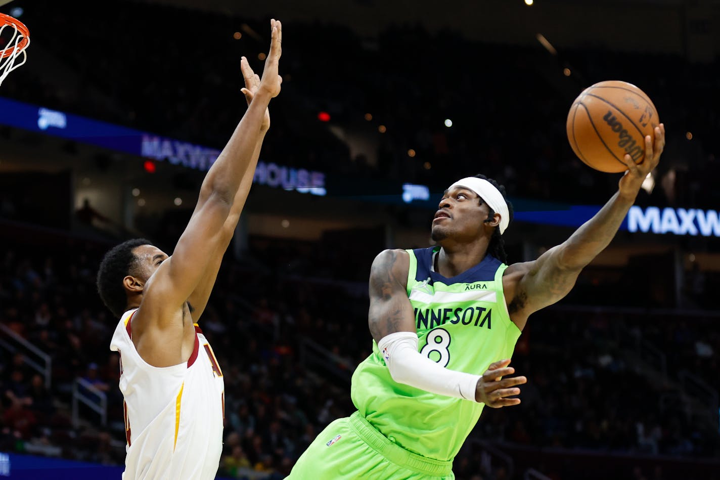 Minnesota Timberwolves' Jarred Vanderbilt (8) shoots against Cleveland Cavaliers' Evan Mobley (4) during the second half of an NBA basketball game, Monday, Feb. 28, 2022, in Cleveland. The Timberwolves won 127-122. (AP Photo/Ron Schwane)